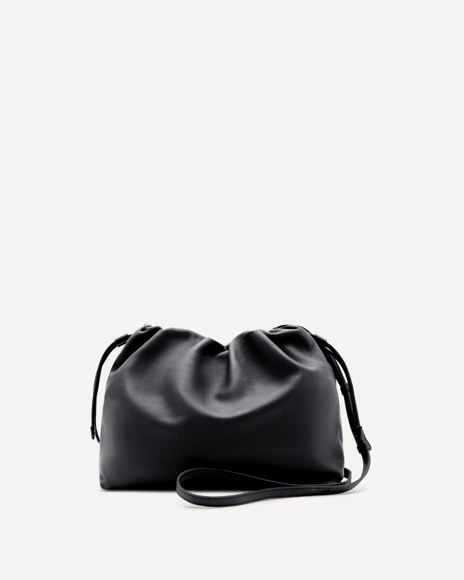Black leather clutch bag on a light gray background