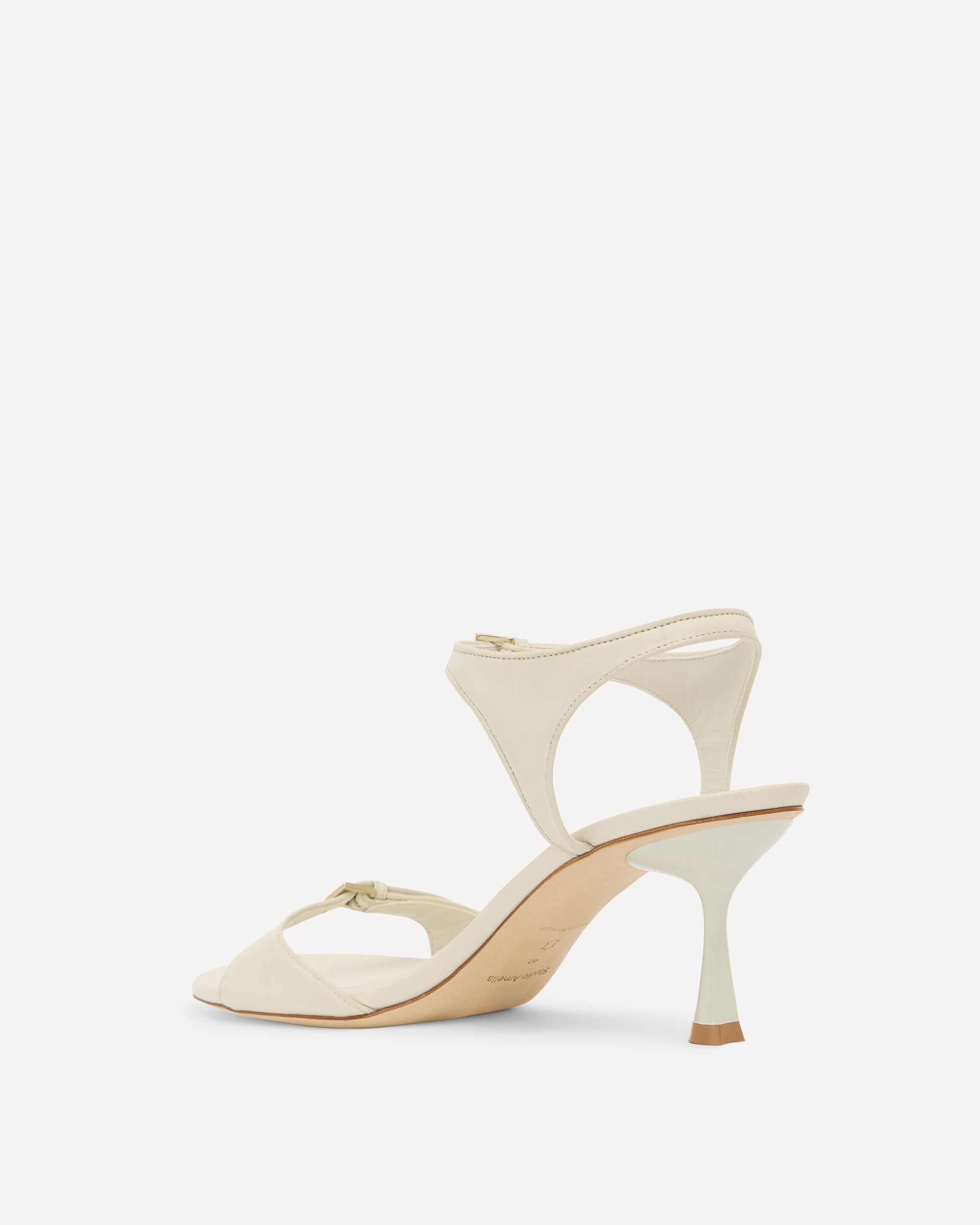 White high-heeled sandal on a white background