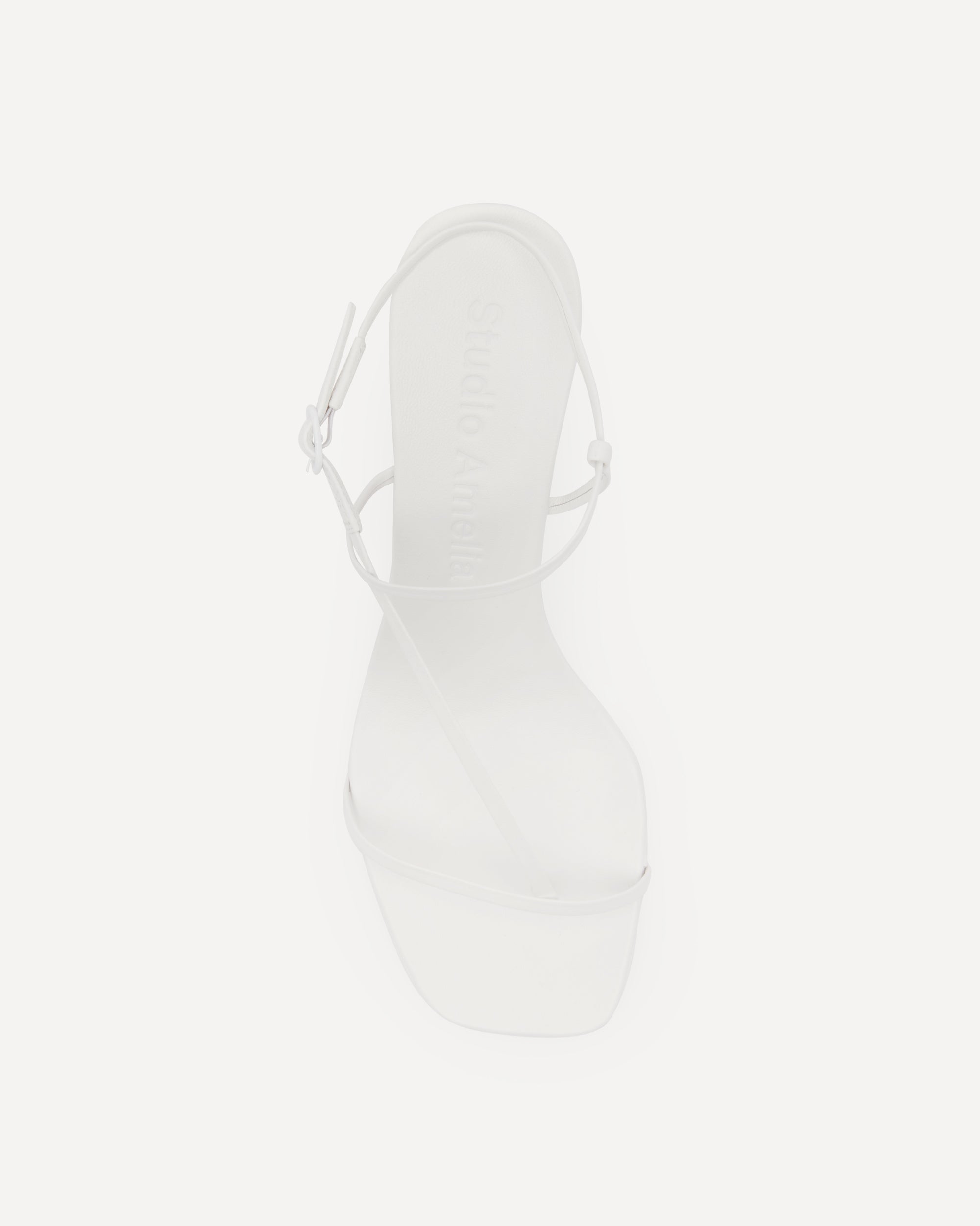 White strappy sandal on a high heel