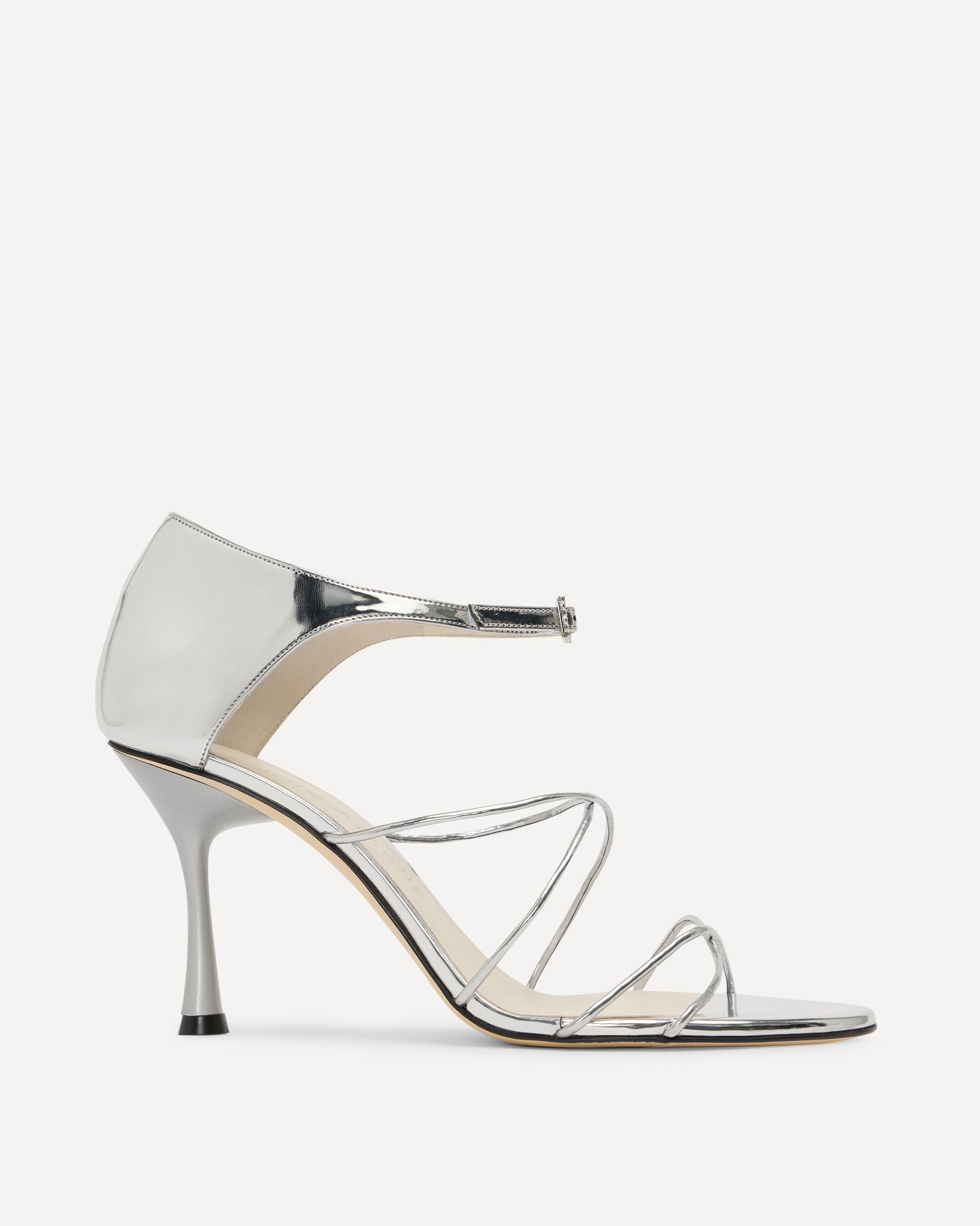 Silver high-heeled sandal with straps on a white background