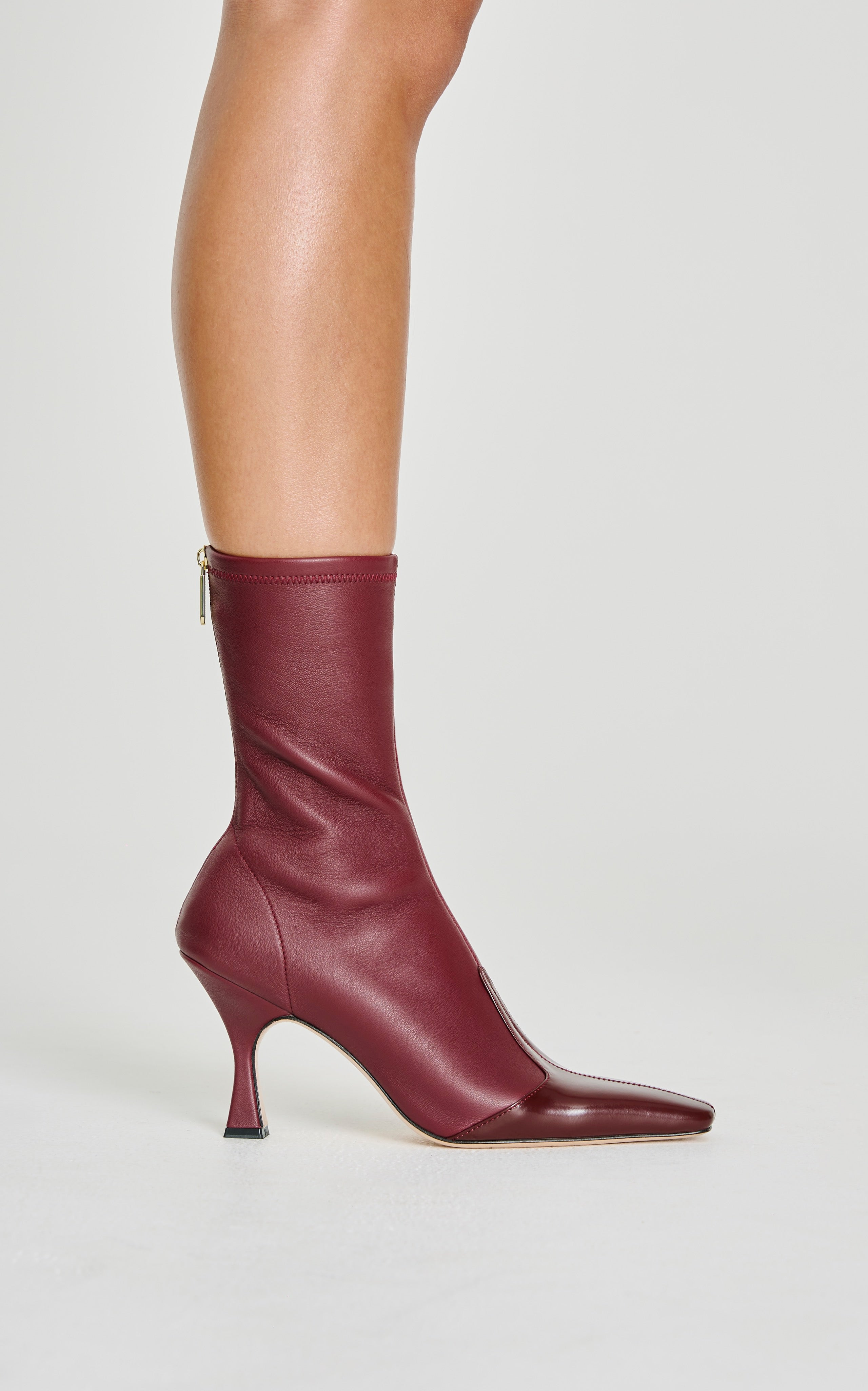 Burgundy ankle boots with a high heel