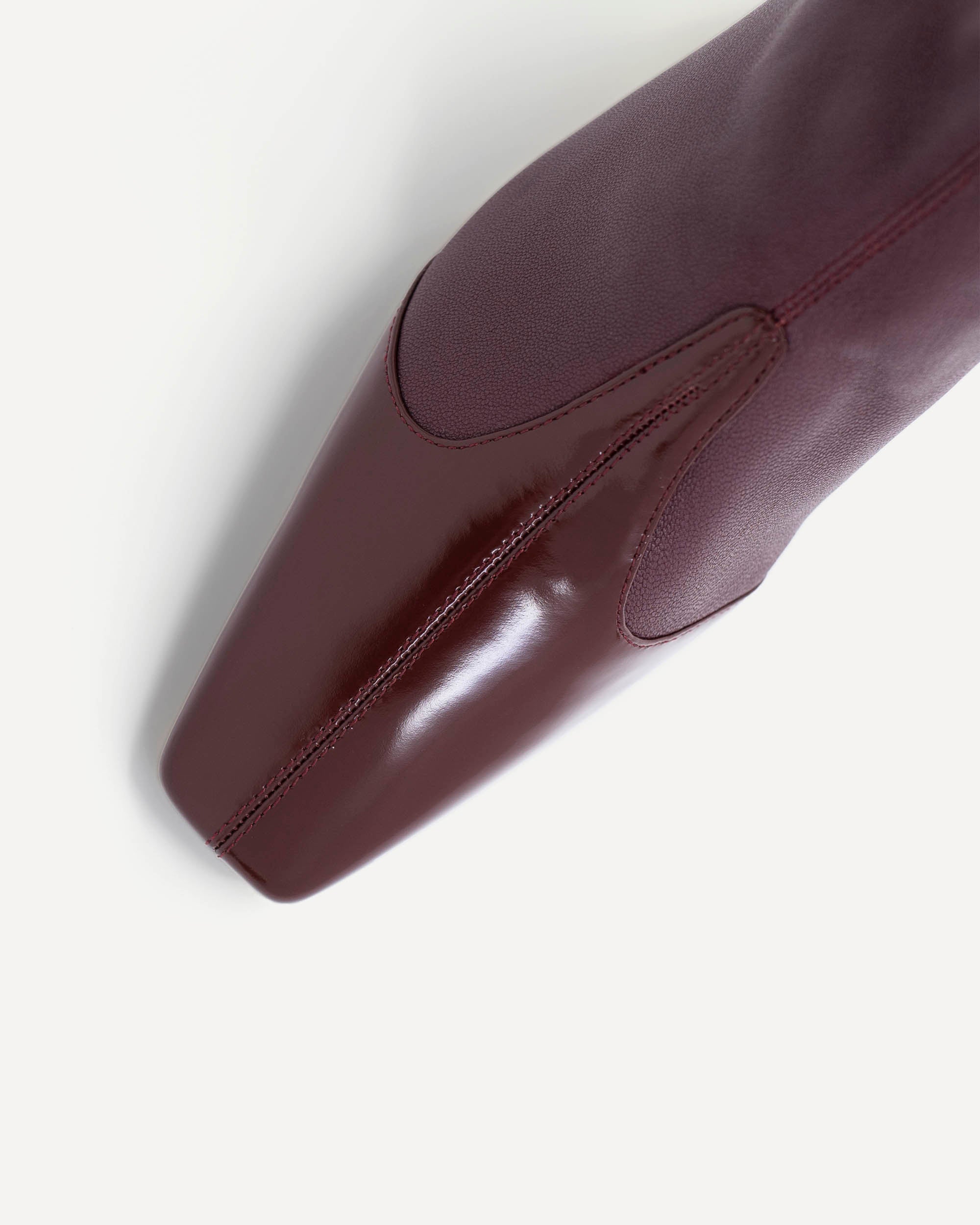 Burgundy coloured leather boots for women