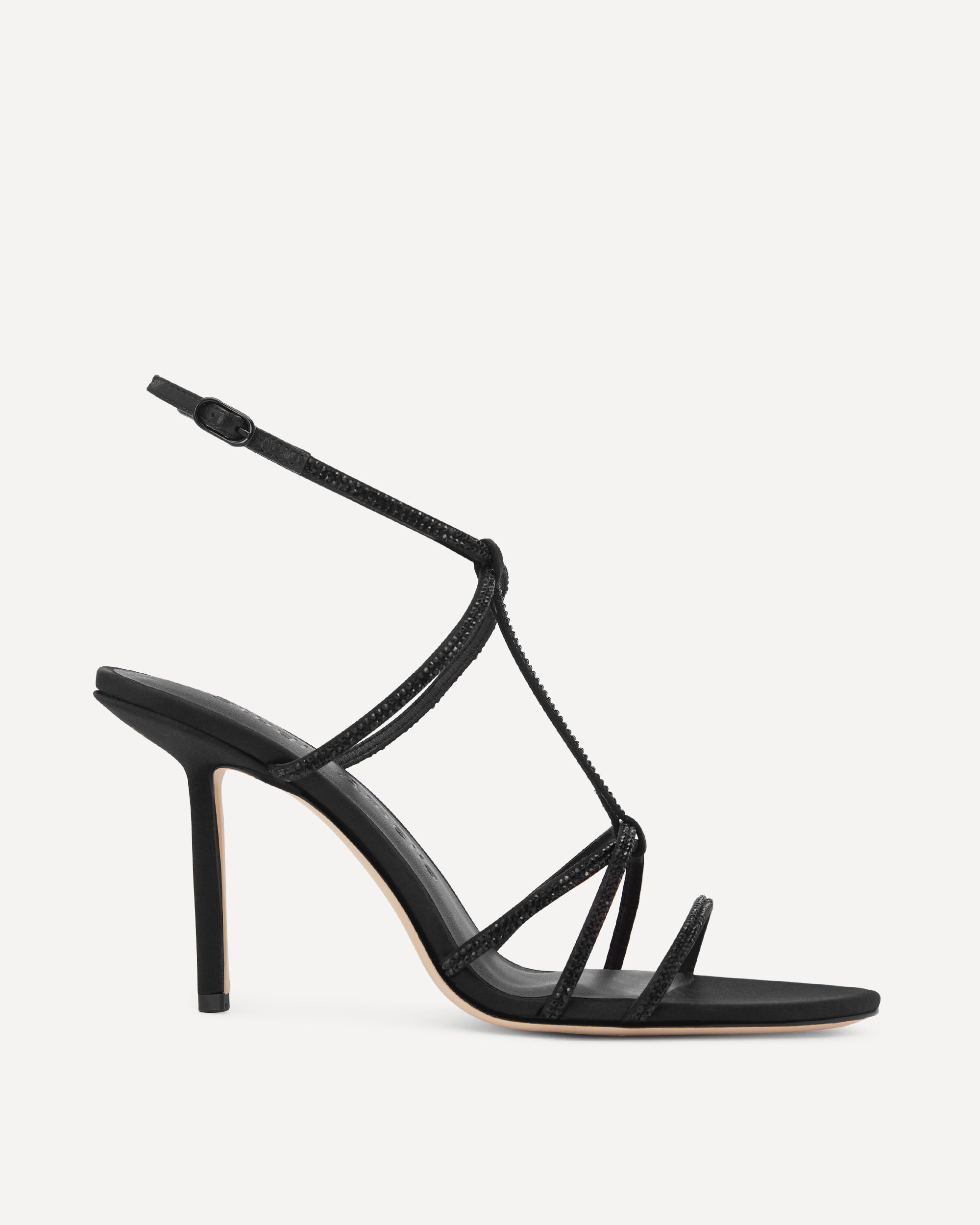 Black strappy high-heeled sandal with black diamante straps on a white background