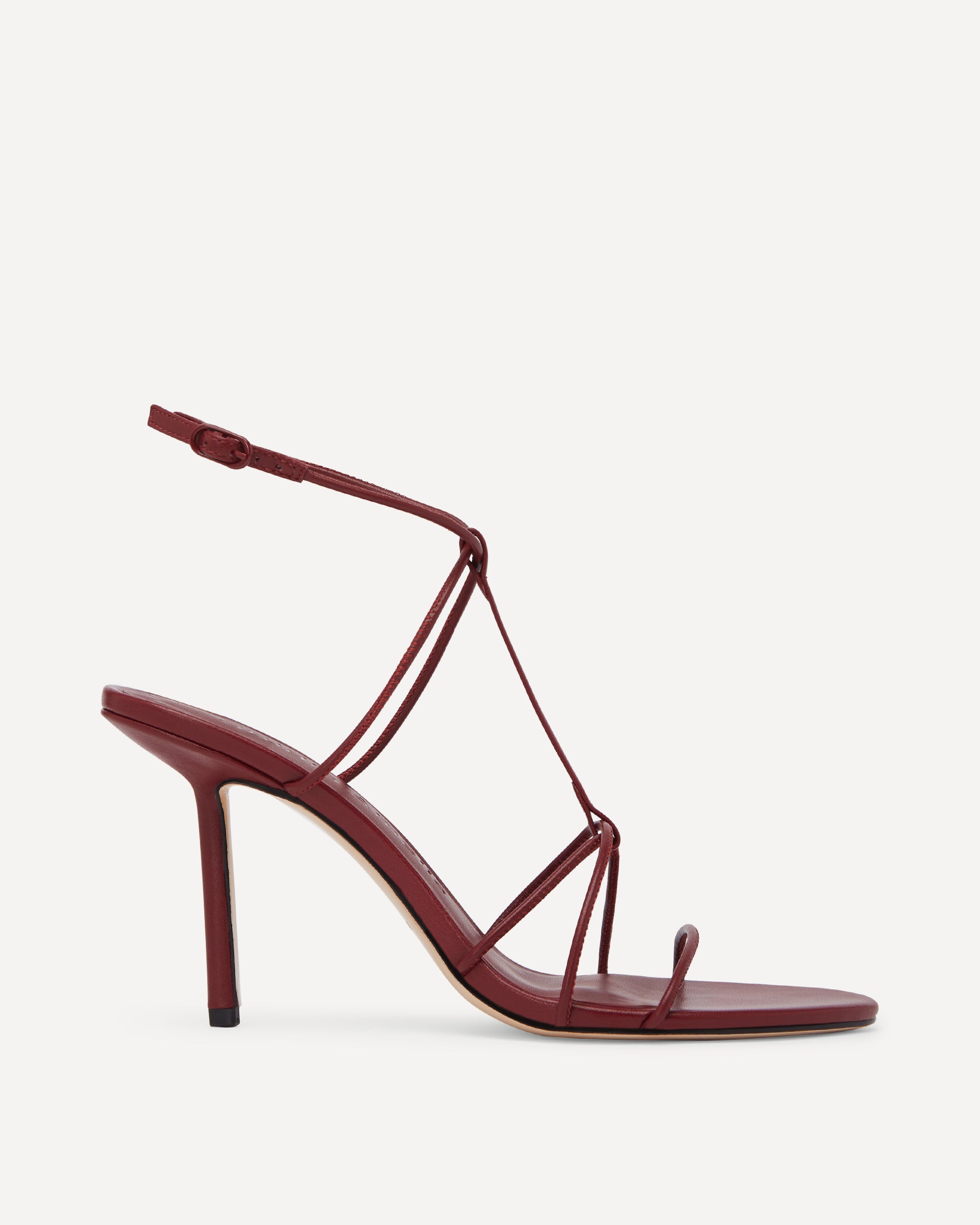 Red high heeled sandals with thin straps