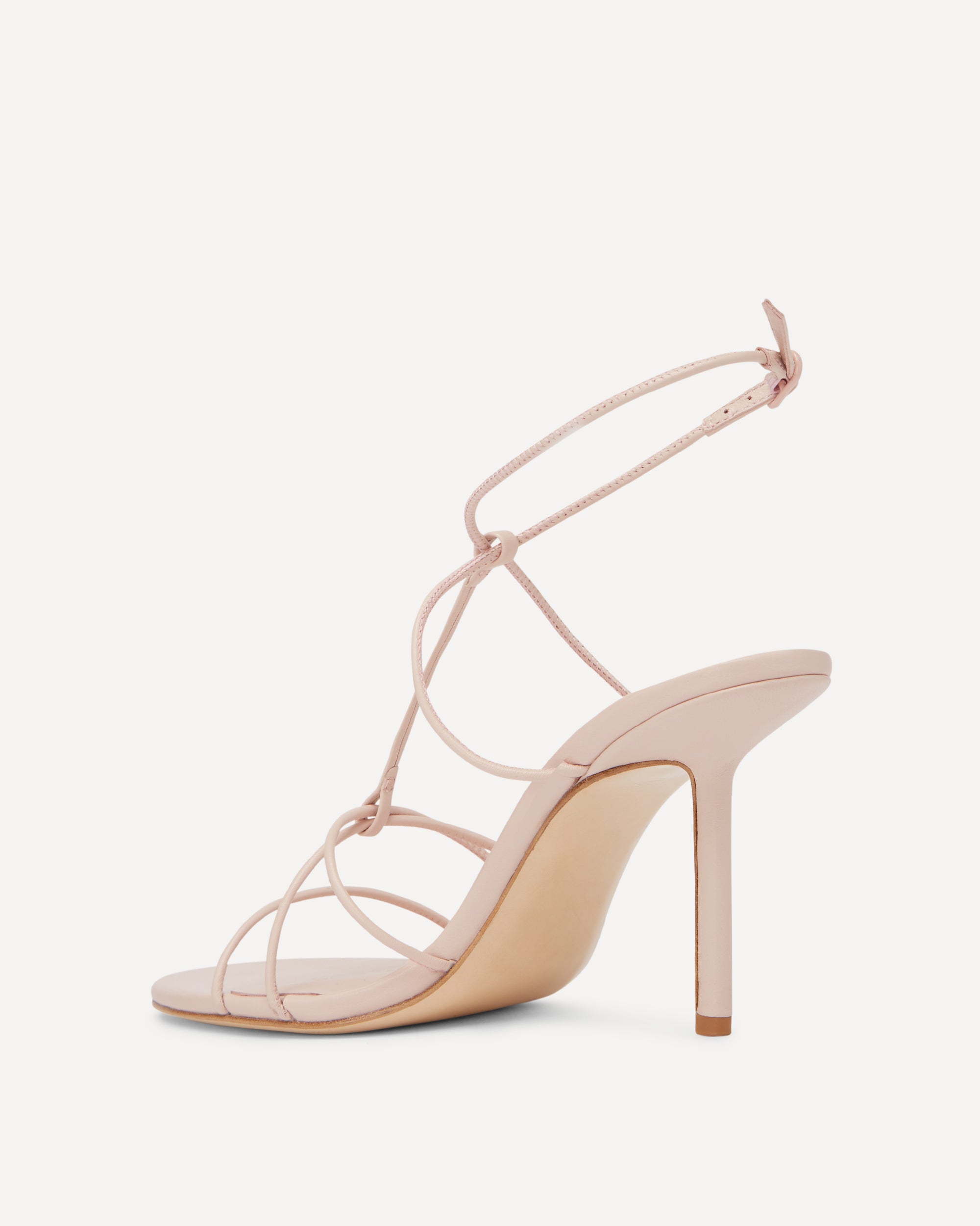 A pink high heel with thin straps