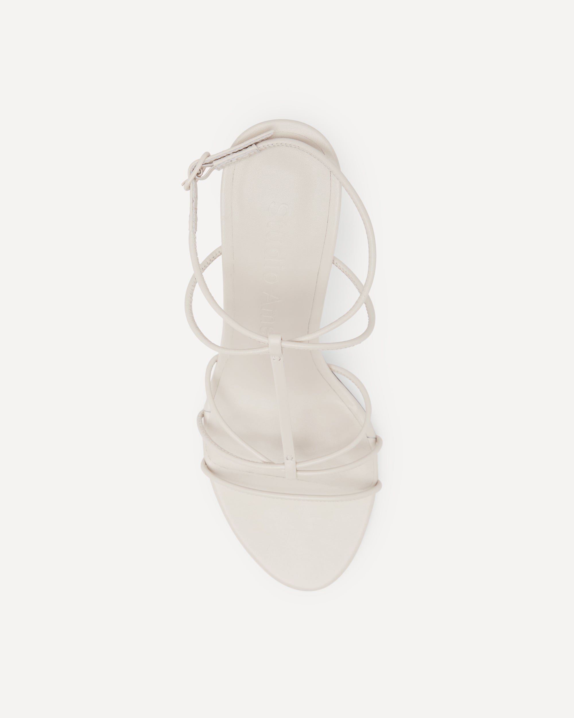 A white strappy sandal by Studio Amelia