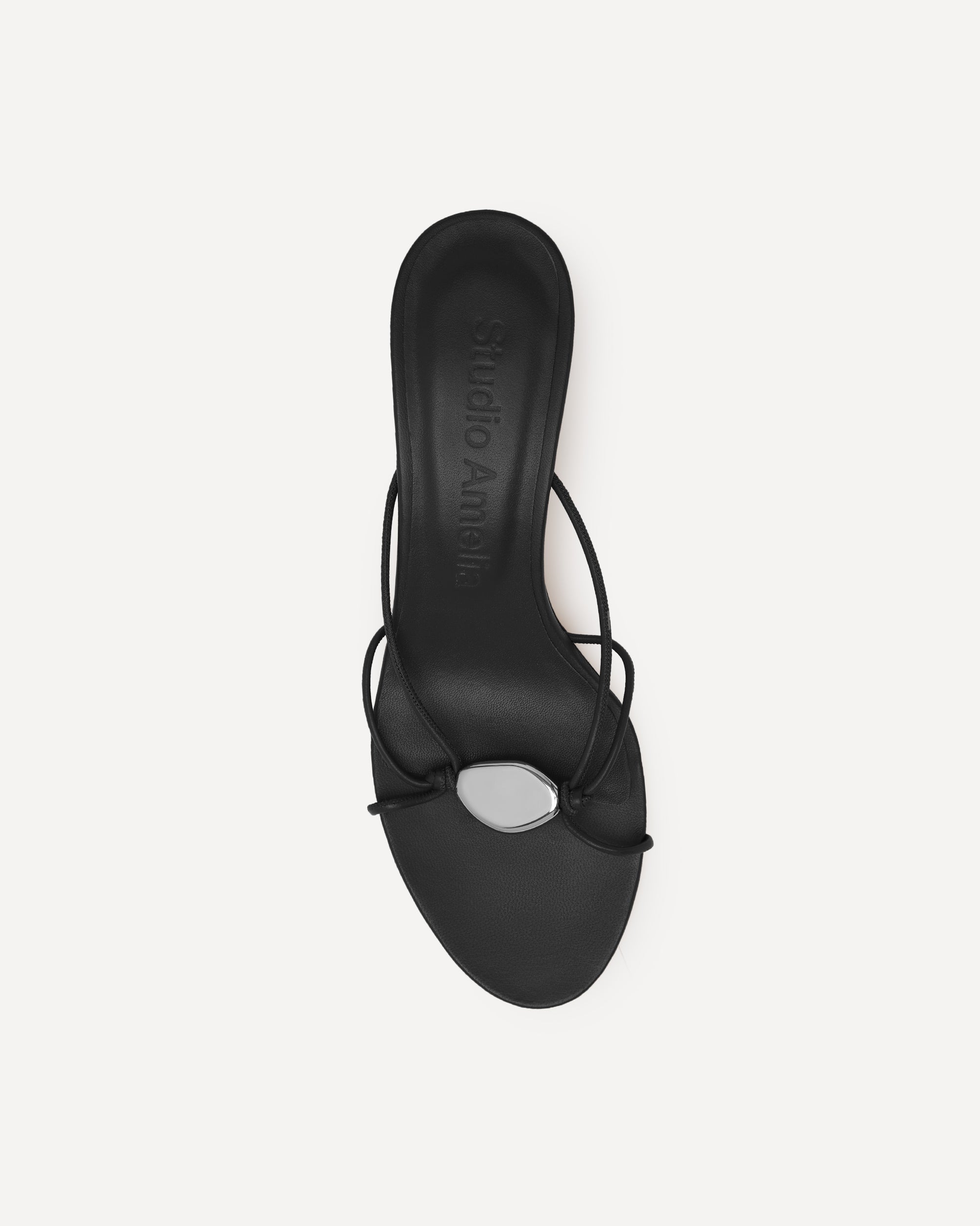 A black leather kitten heeled sandal
