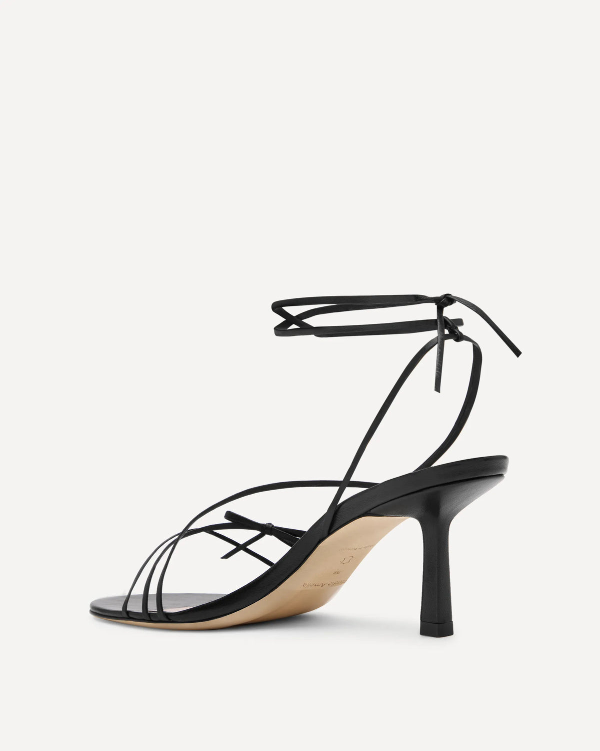 A black strappy high heel made for summer