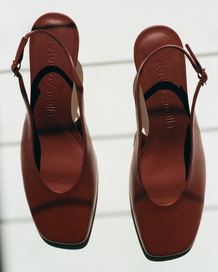 Pair of Studio Amelia maroon coloured leather pumps