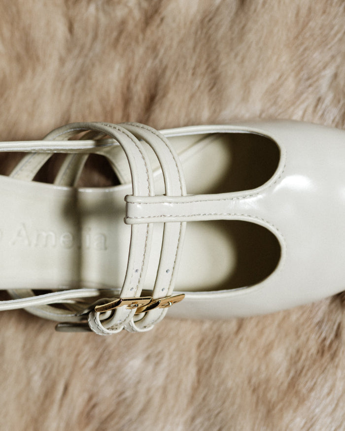 A buckled cream leather heel