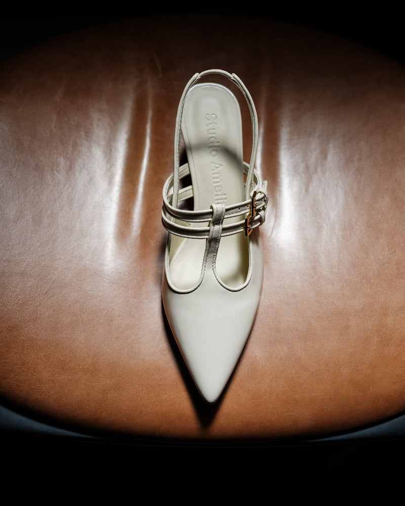 A cream closed toe leather pump
