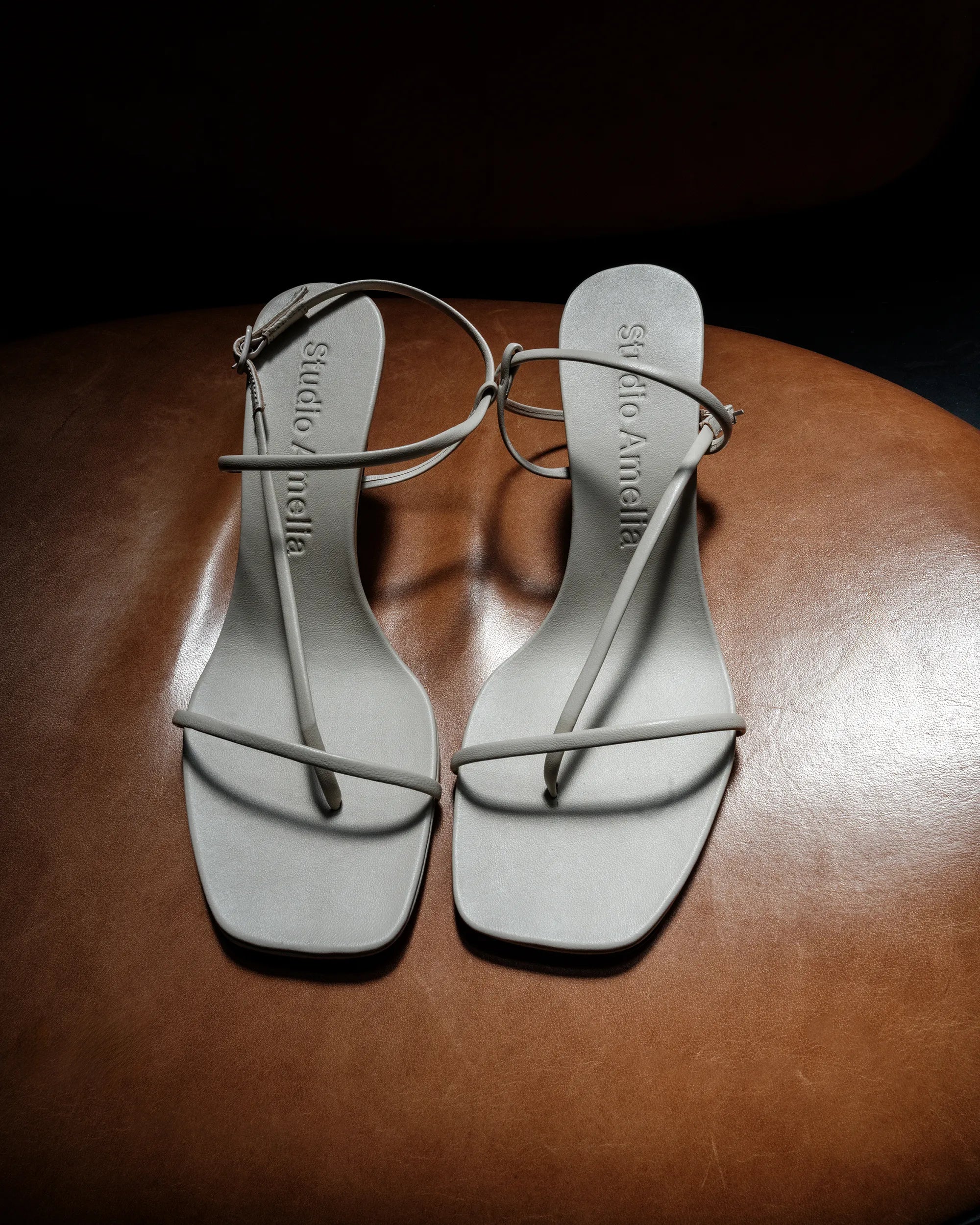 Pair of white strappy sandal heels