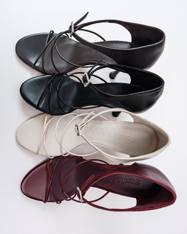 Grey, black, white and burgundy leather high heels with criss-cross straps