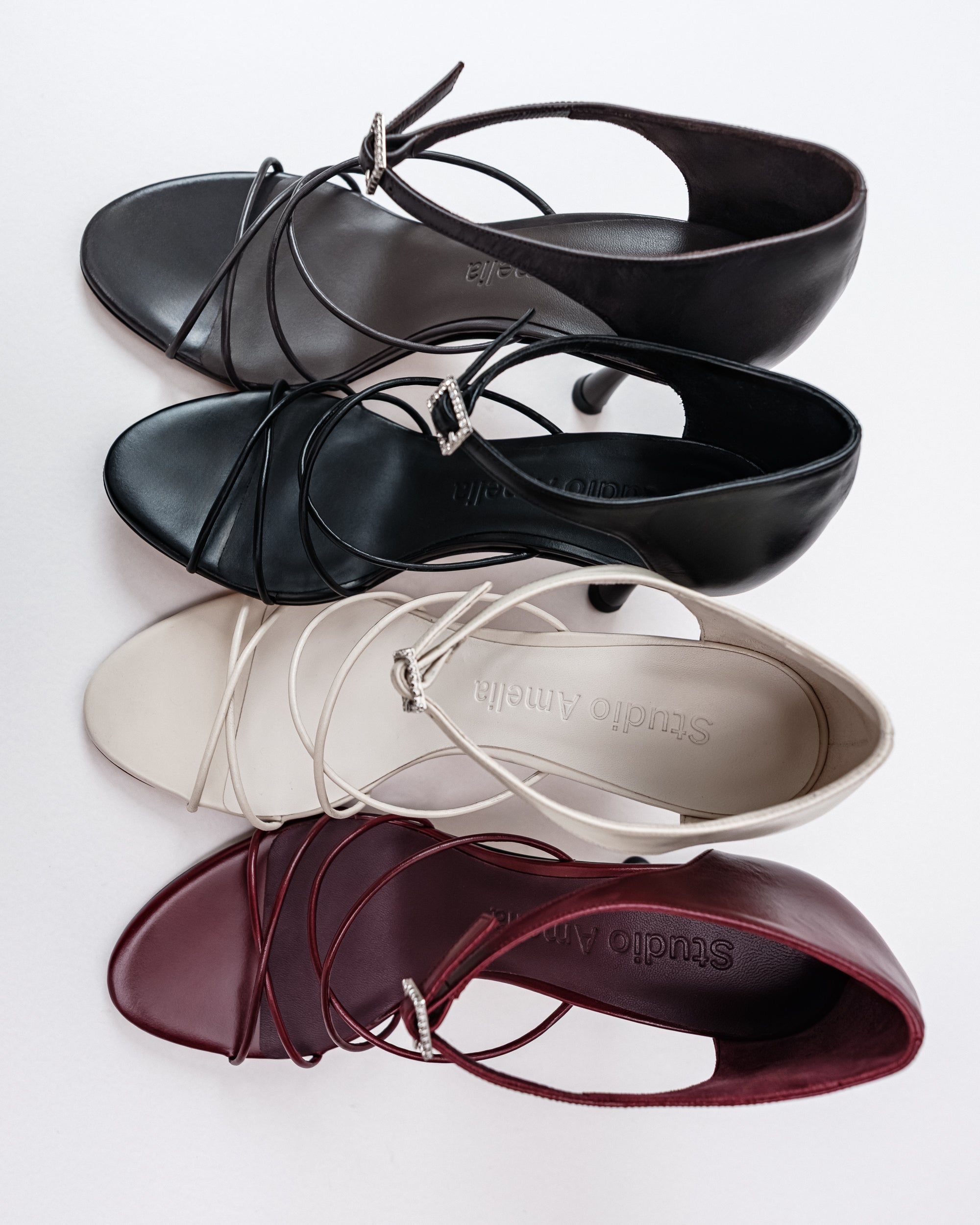 Grey, black, white and burgundy leather high heels with criss-cross straps