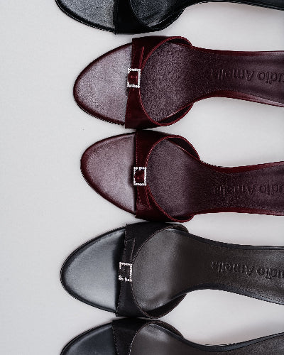 black and maroon kitten heels with silver buckle