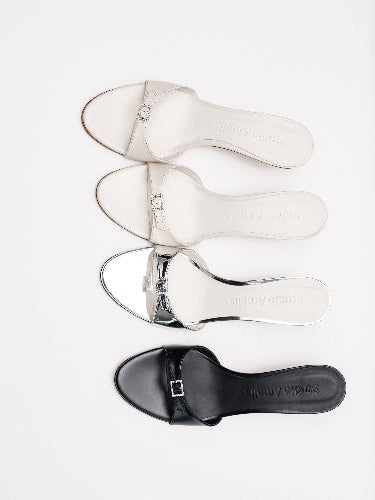 Four leather sandals with silver buckle