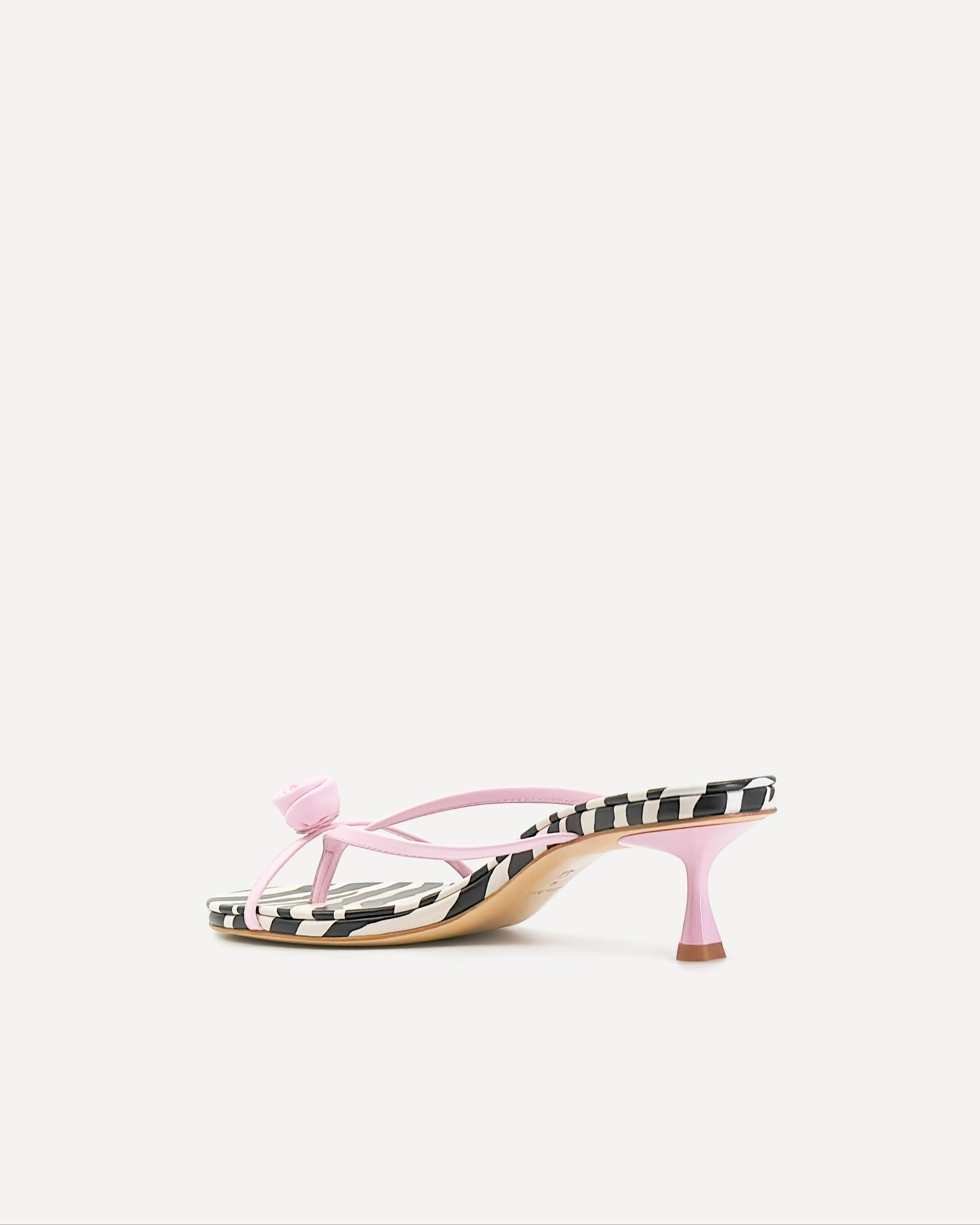 A pink leather kitten heel sandal