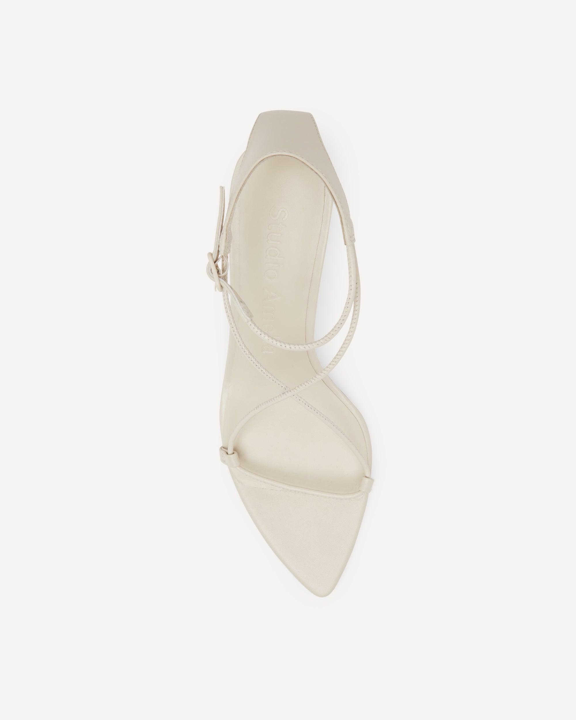 White high-heeled shoe on a white background