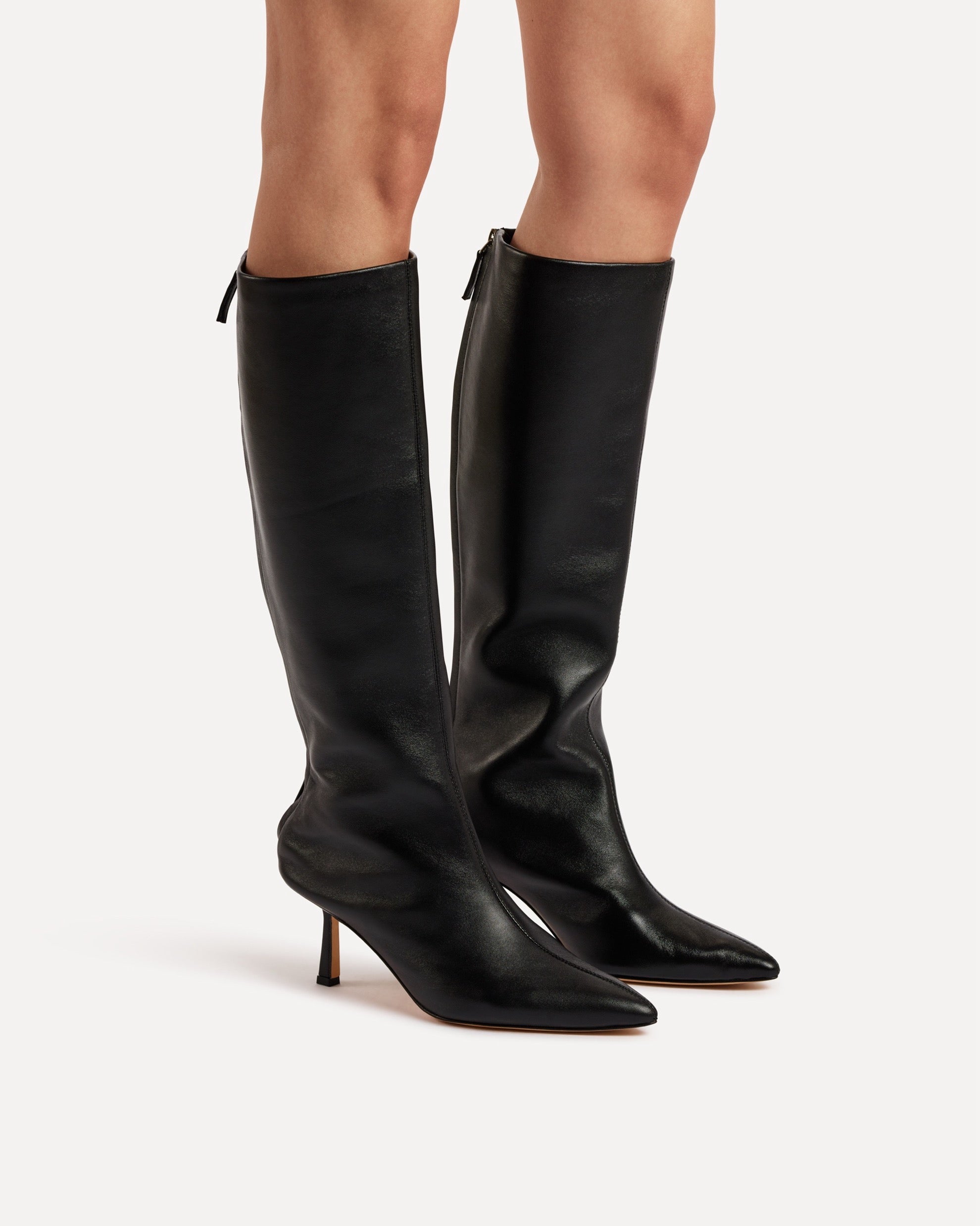 A black leather calf boot with heel