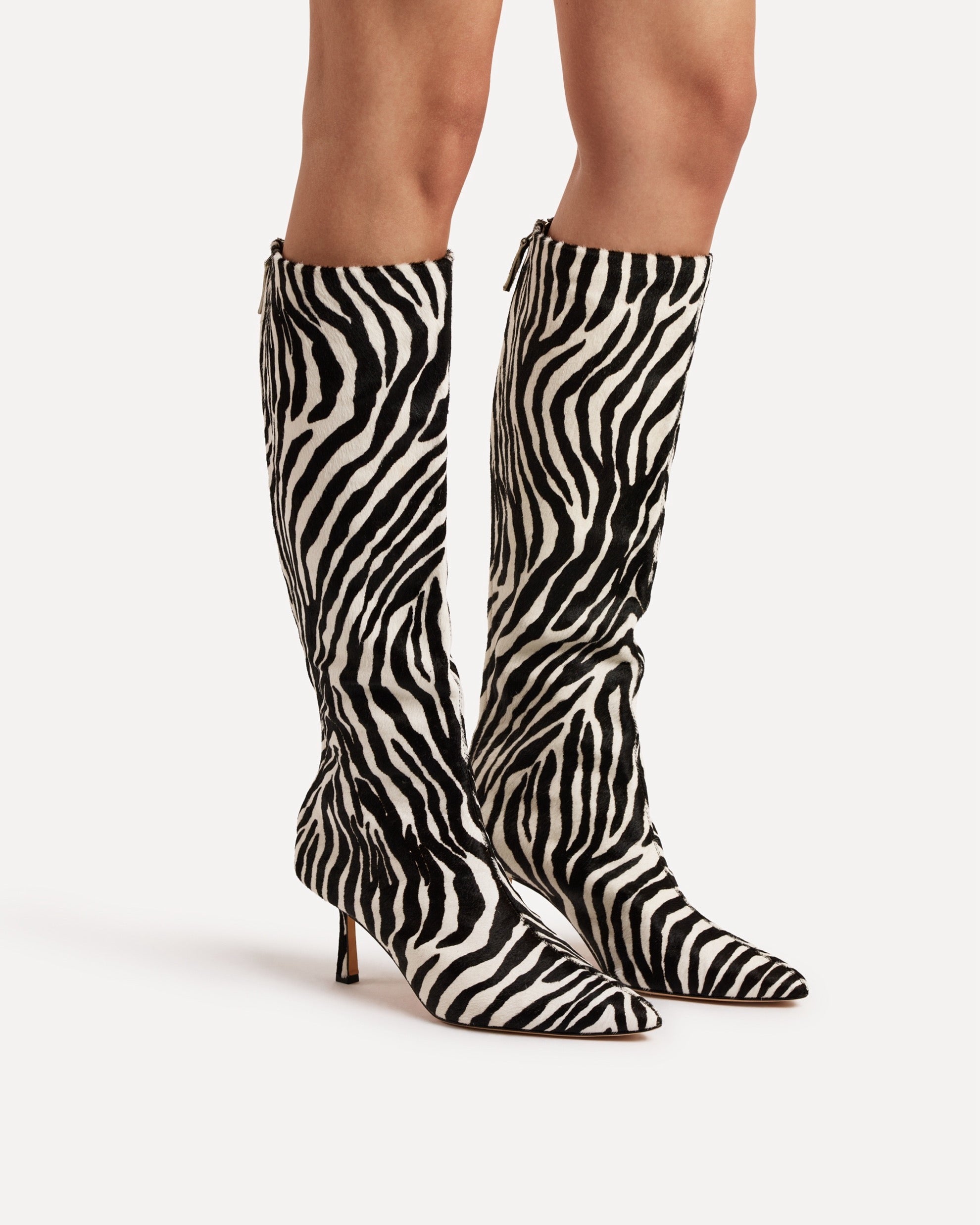 A zebra printed calf boot with heel