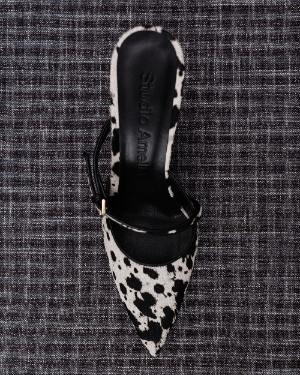 A black and white patterned heel with pointed toe