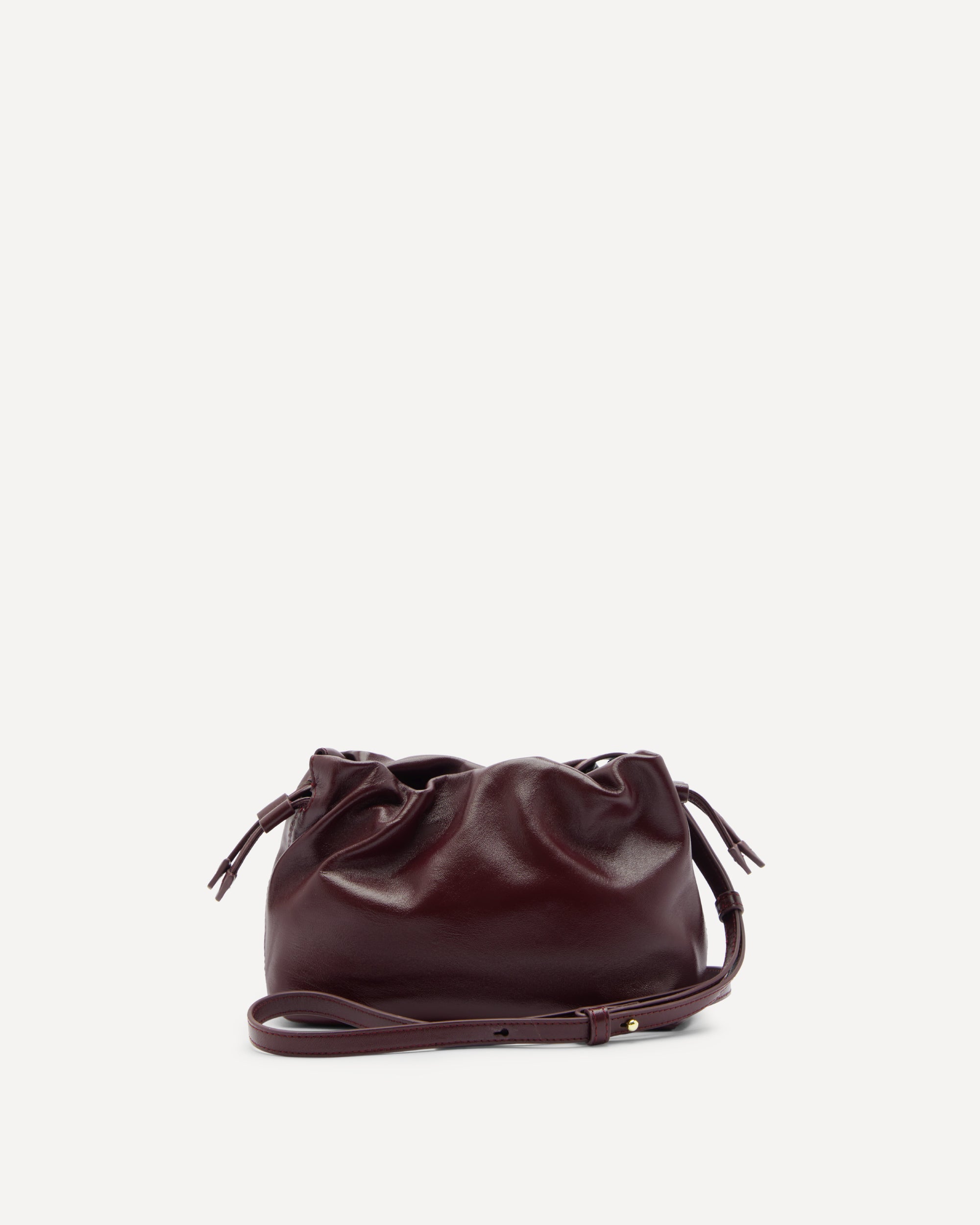 Brown leather drawstring bag on a white background
