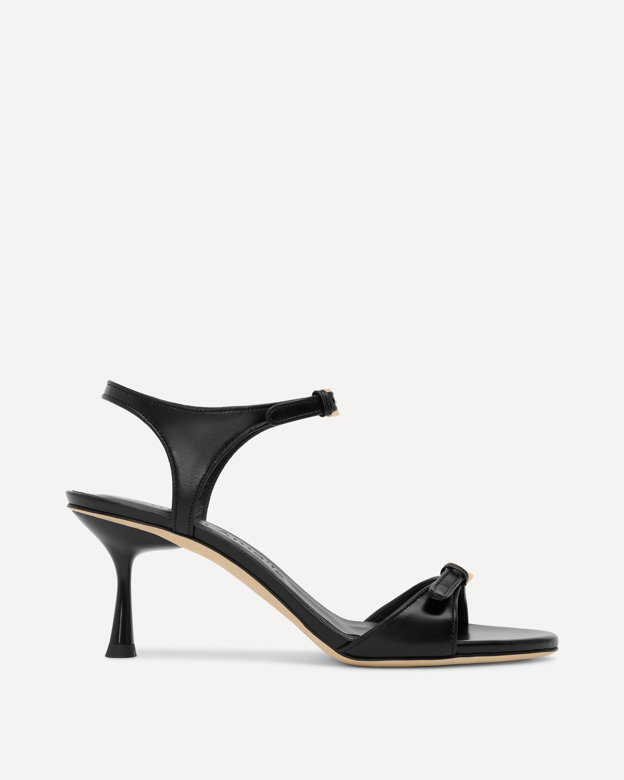 Black sandal with a unique heel design on a white background