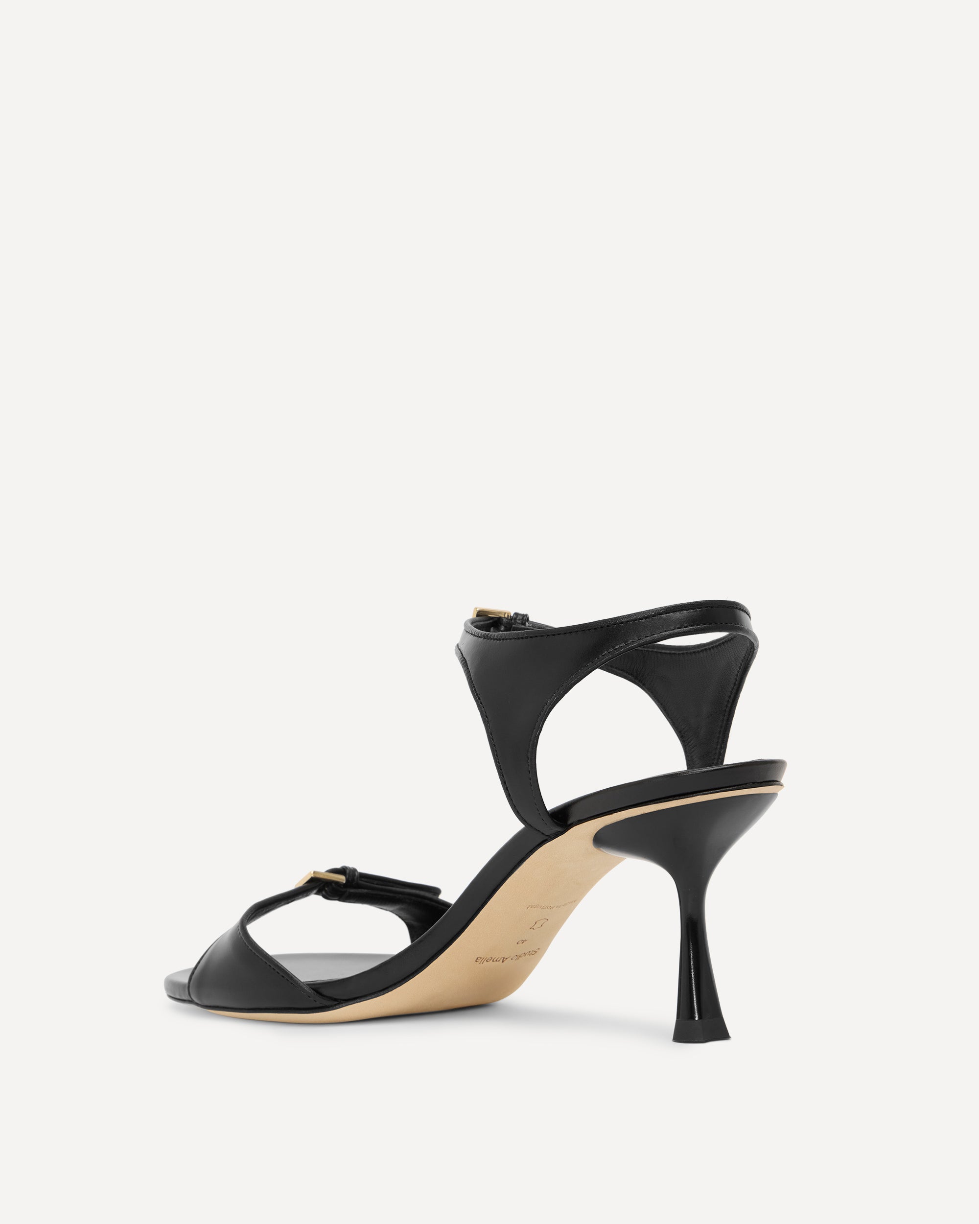 Black high-heeled sandal on a white background