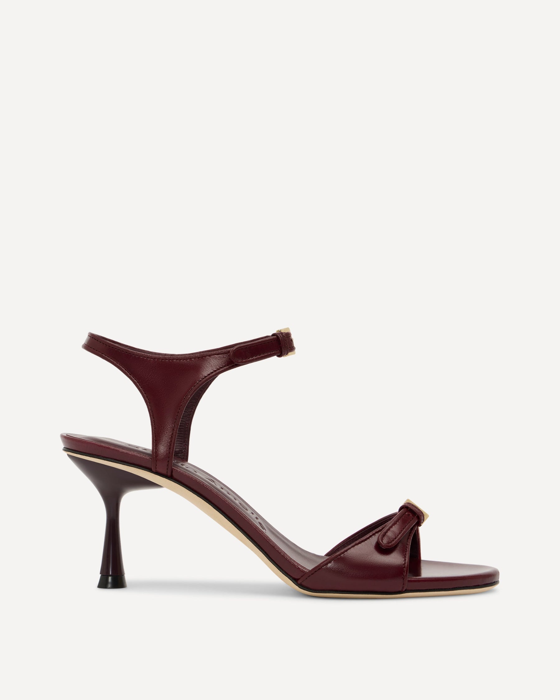 Burgundy high-heeled sandal on a white background