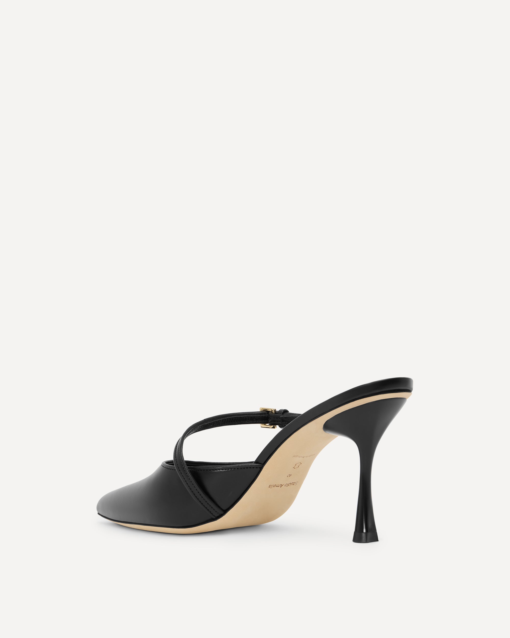 Black leather high heel on white background