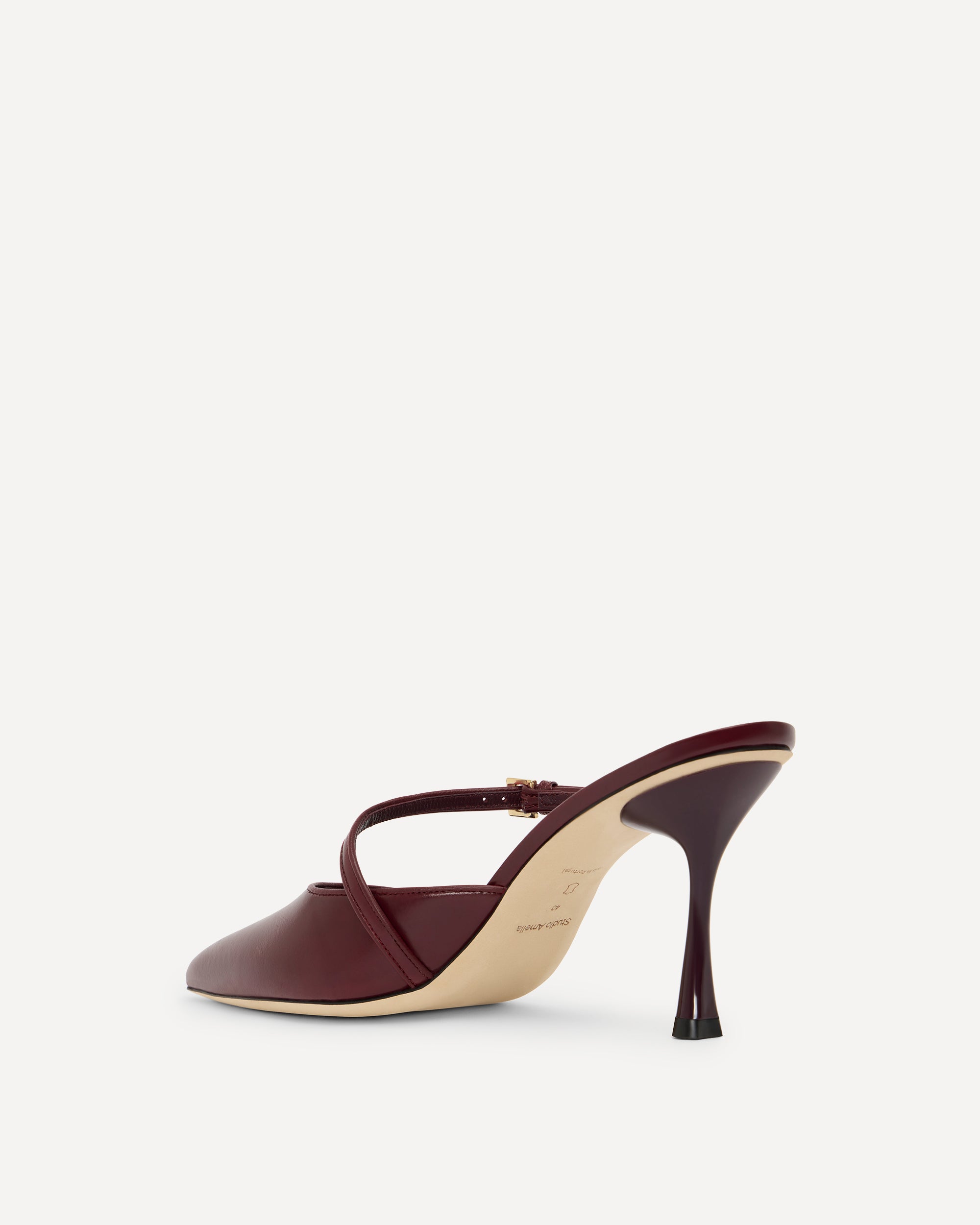 Maroon high-heeled shoe on a white background