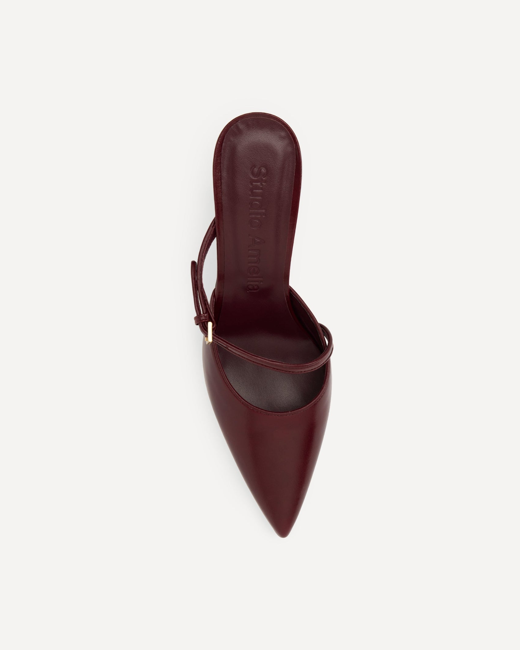 Maroon pointed-toe shoe on a white background