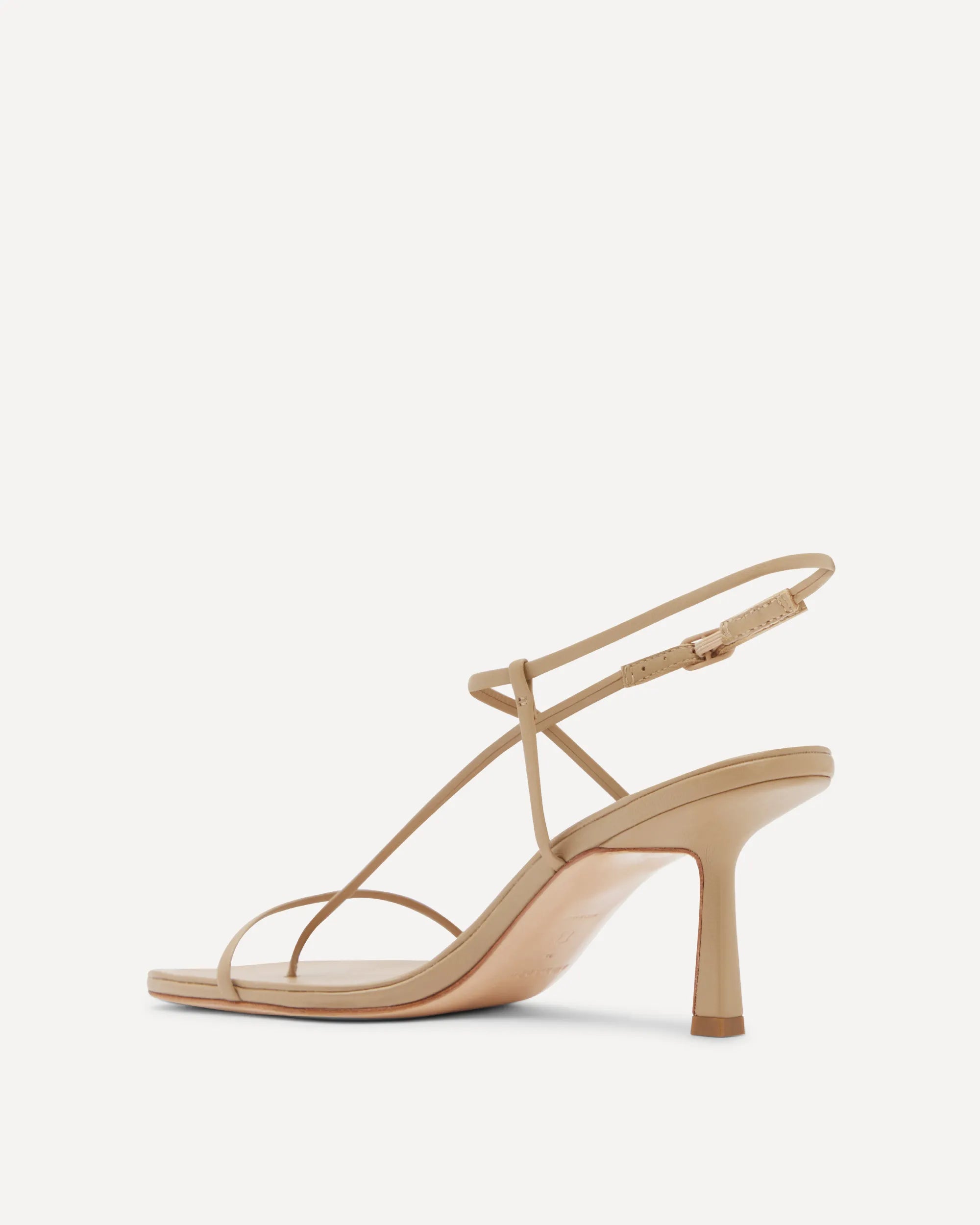 Beige high-heeled sandal on a white background