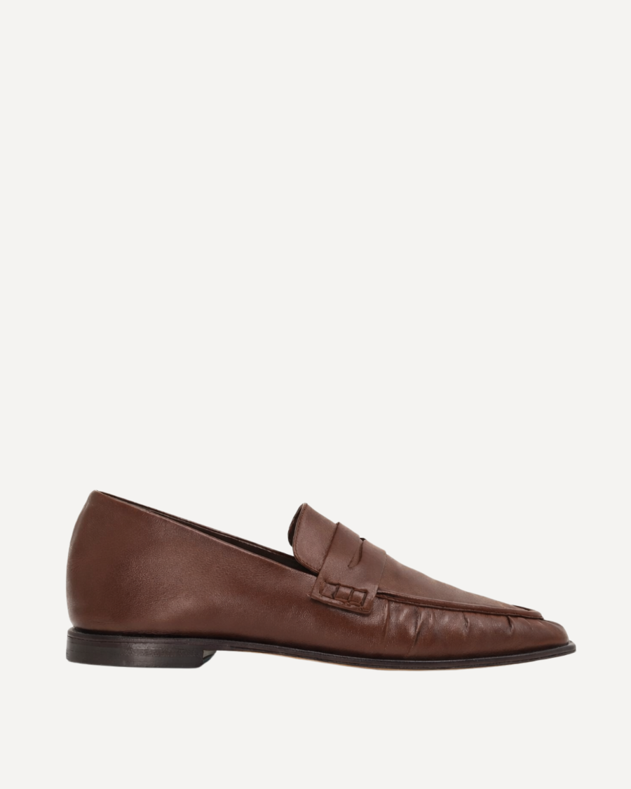 A dark brown leather loafer