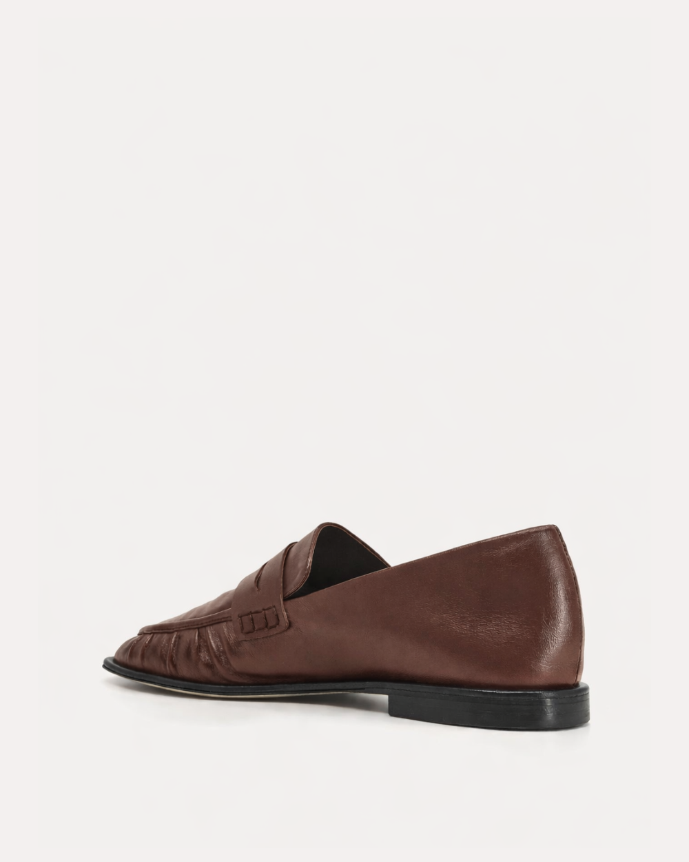 Brown loafer shoe on a white background