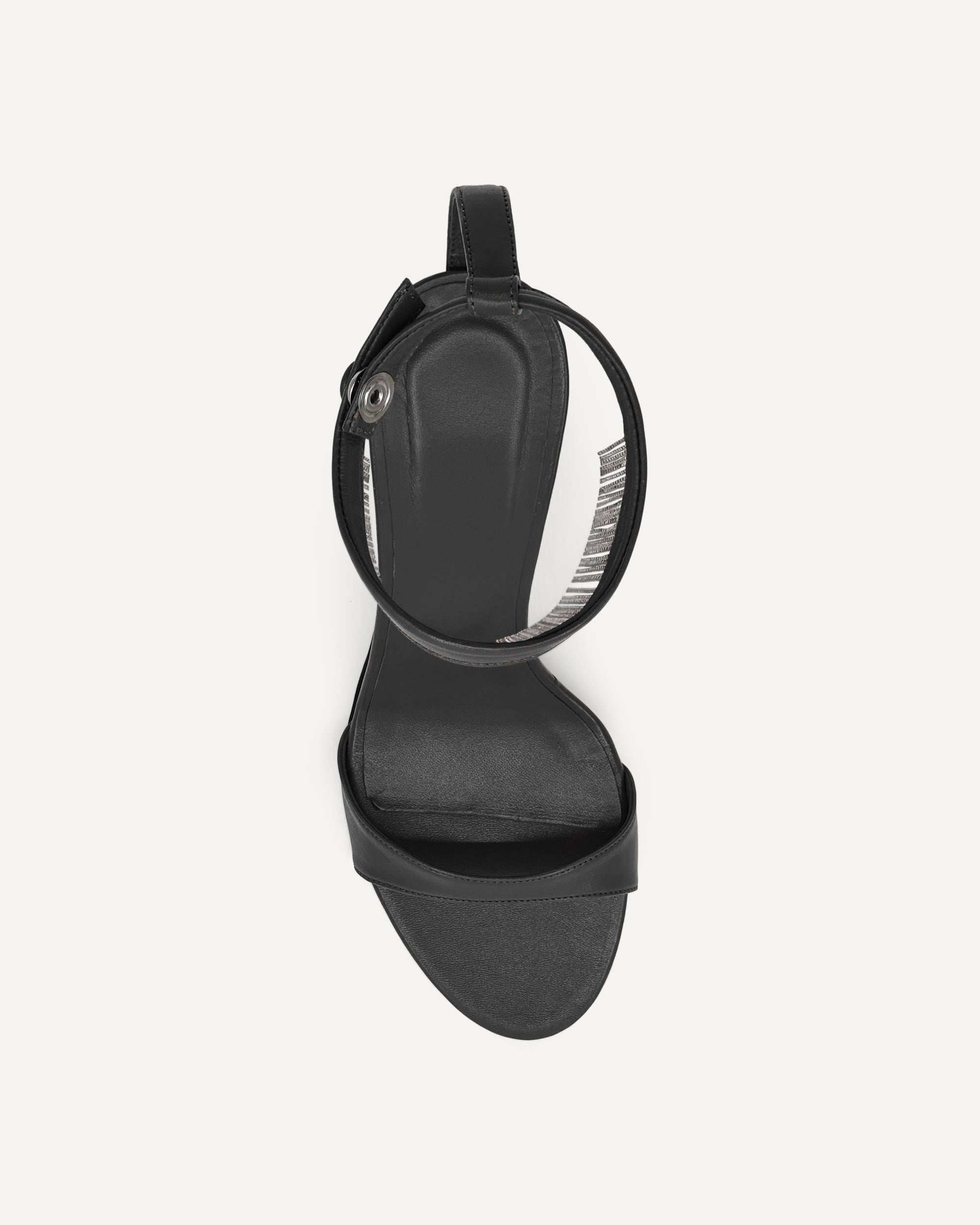 Black high-heeled shoe on a white background