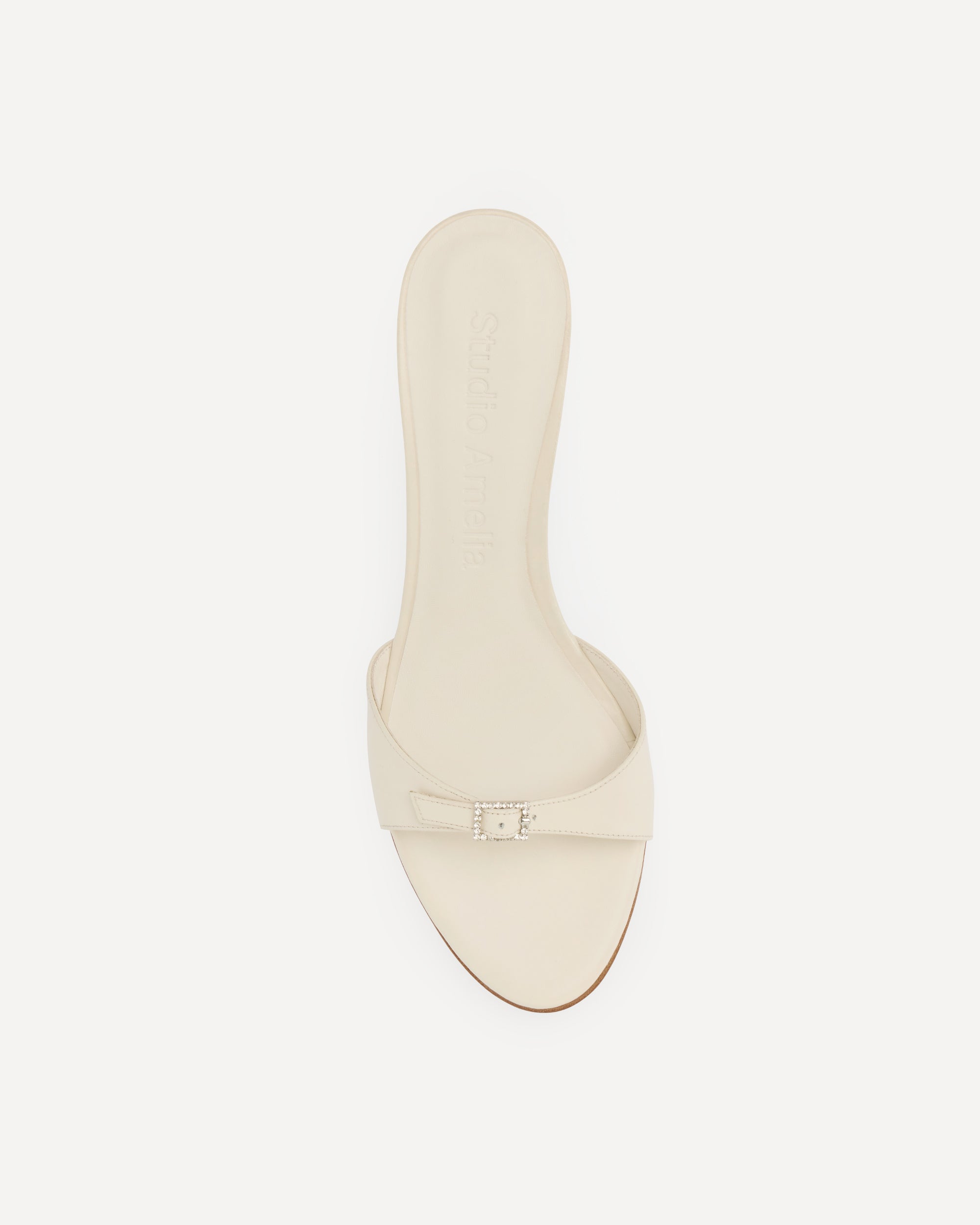 Cream sandal with silver buckle