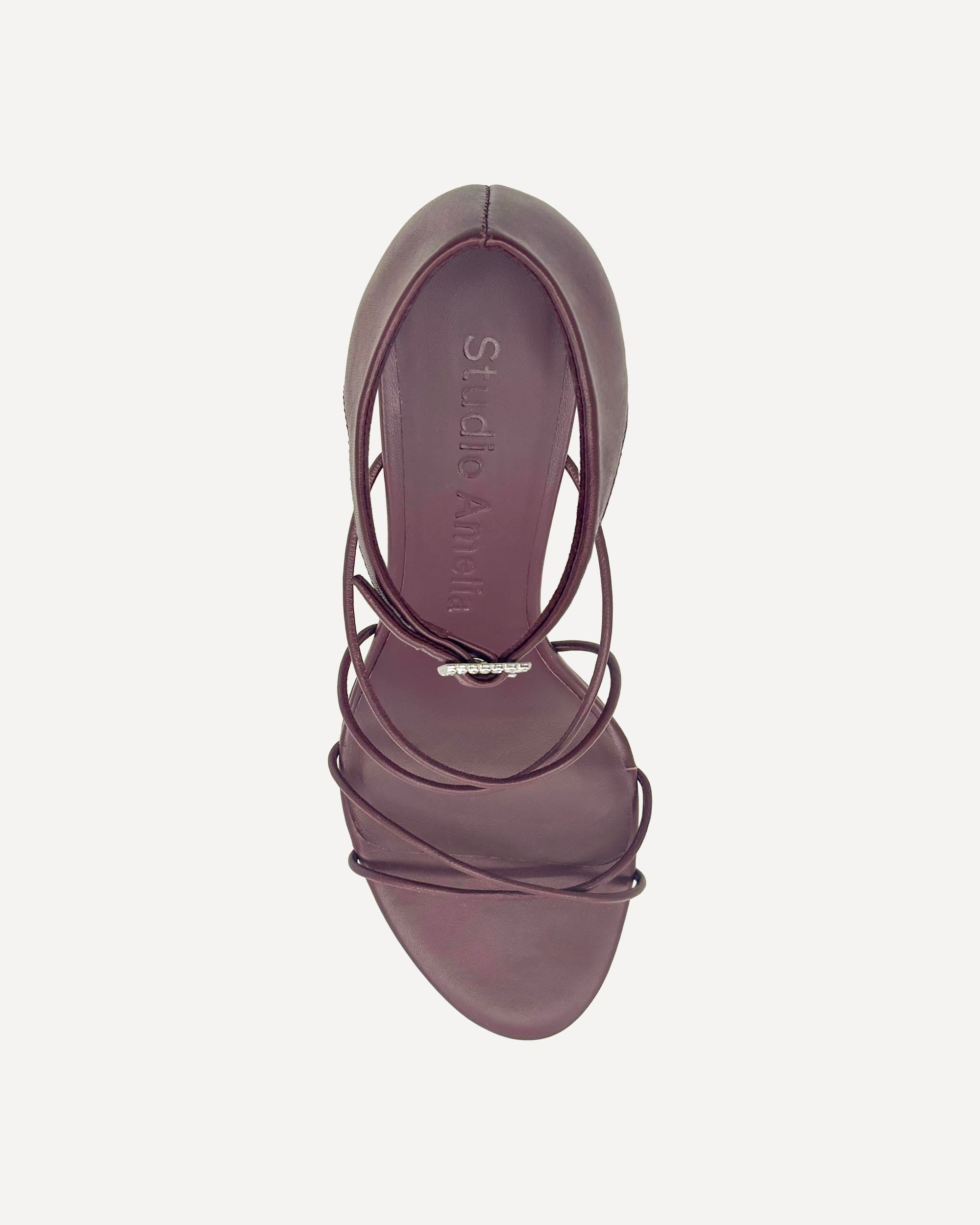 Burgundy high heels with silver buckle