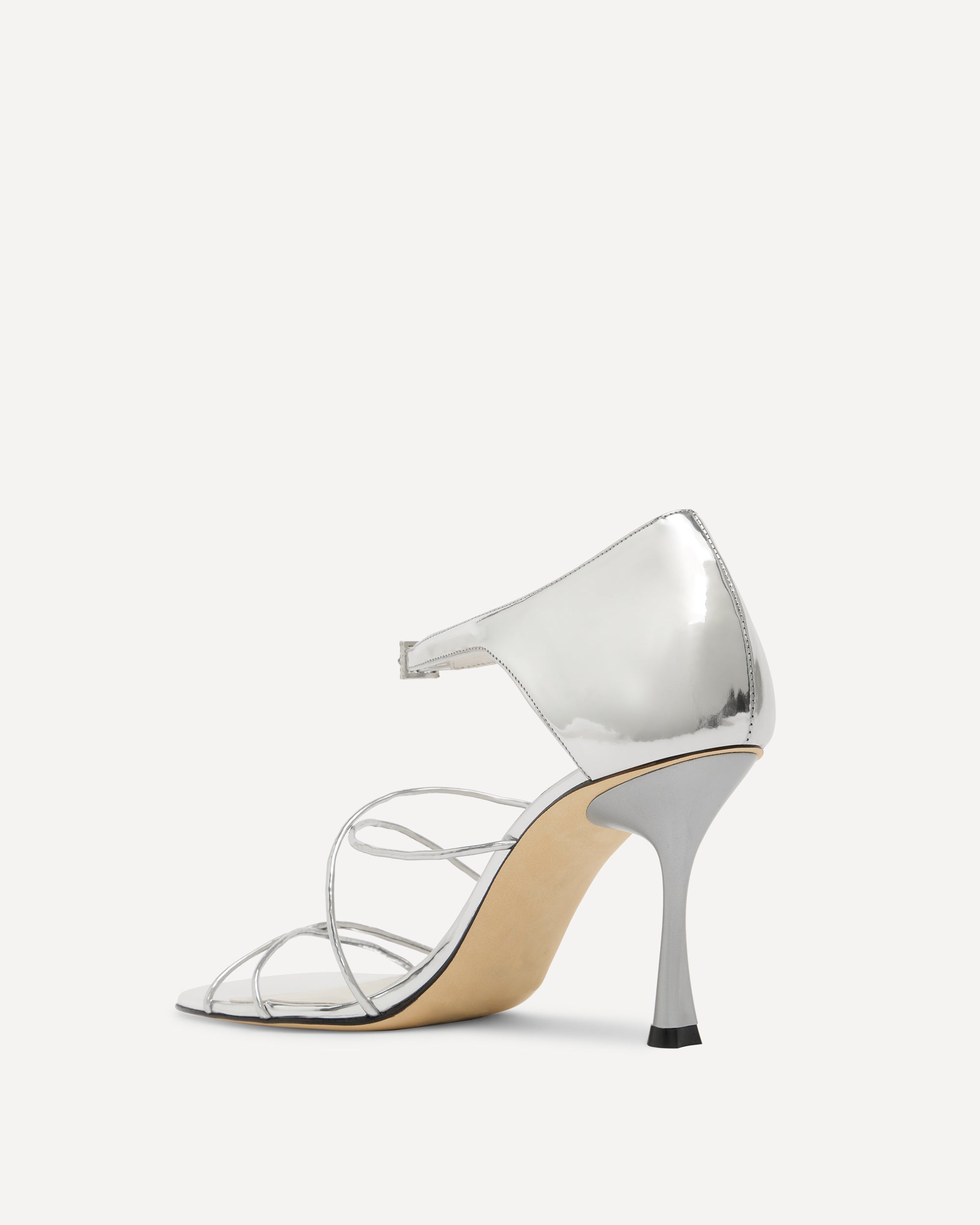 Silver high-heeled shoe on a white background