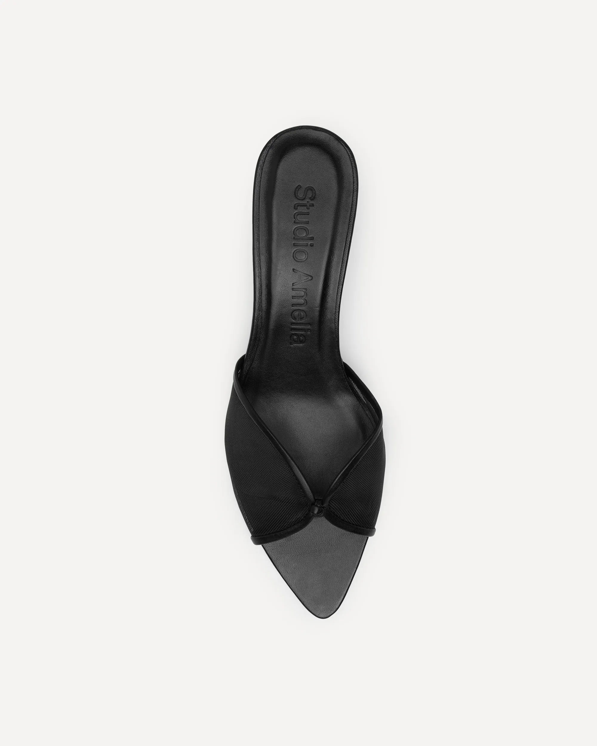 A single black leather slide sandal with a pointed toe and crisscrossing straps, shown from a top-down view on a light gray background. 