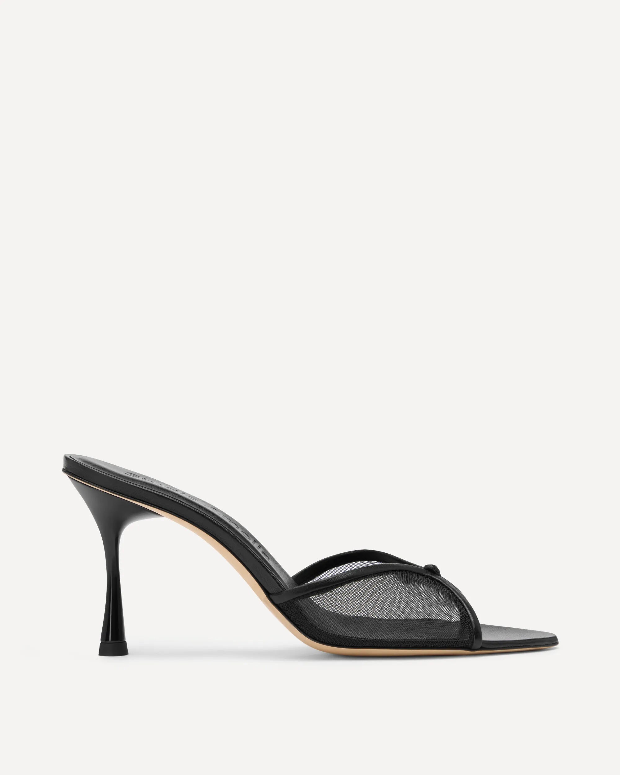 Black high-heeled sandal on a white background
