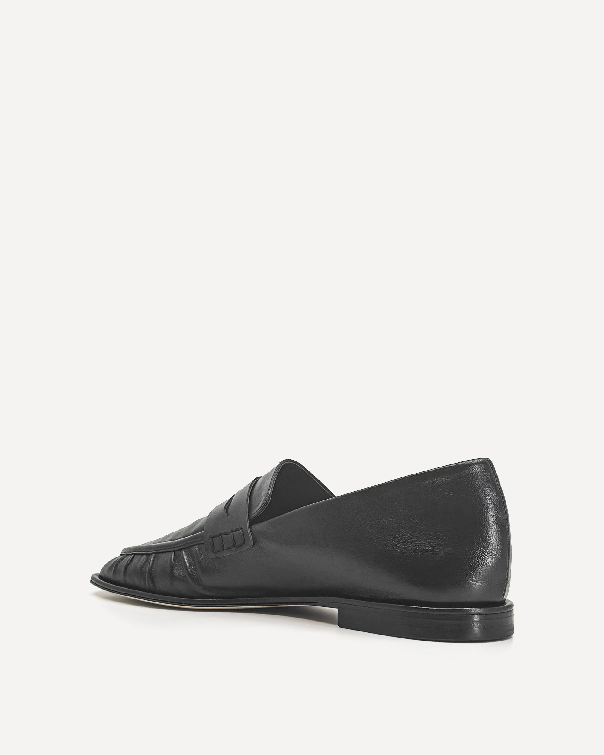 Black loafer shoe on a white background