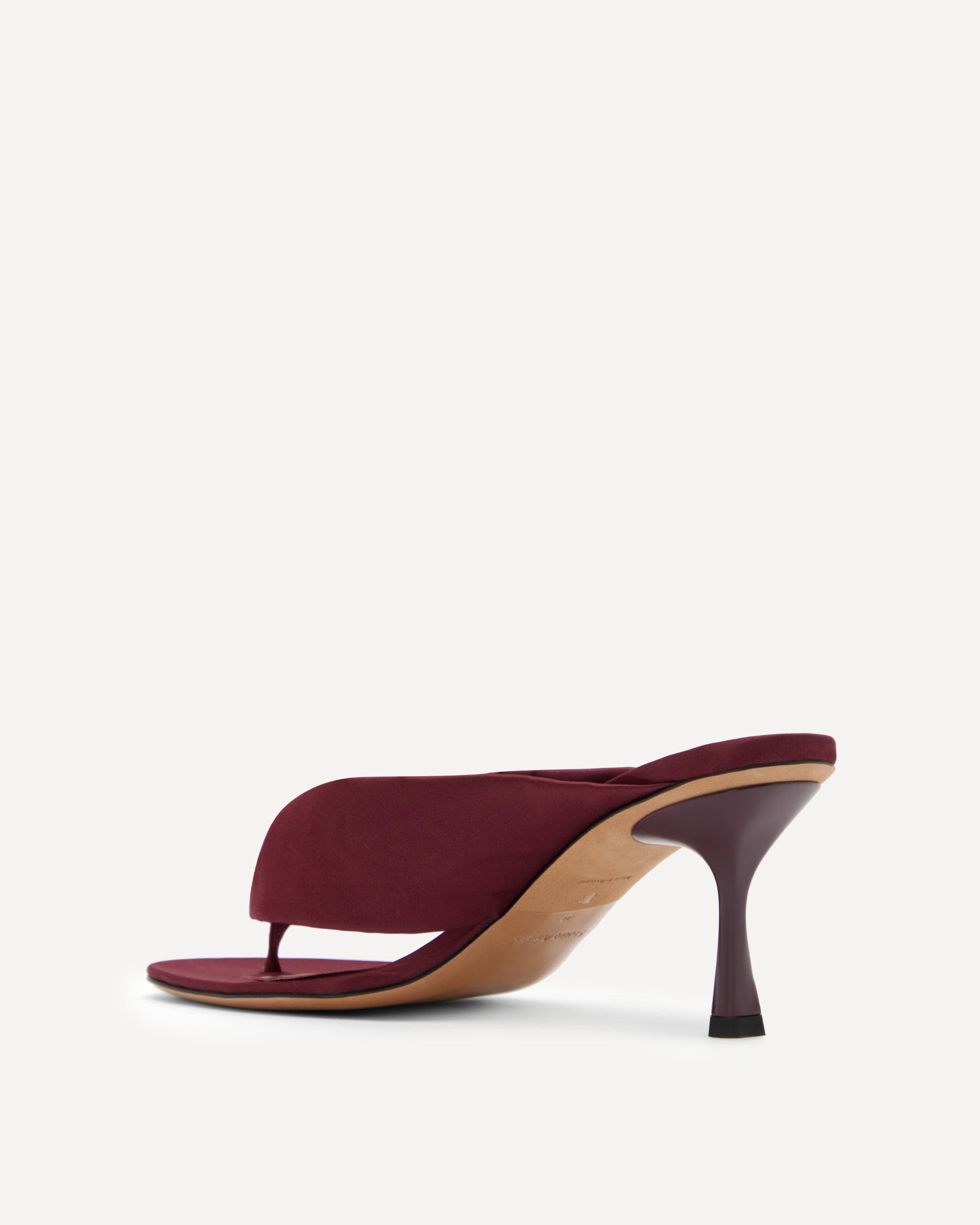 Maroon high-heeled sandal on a white background
