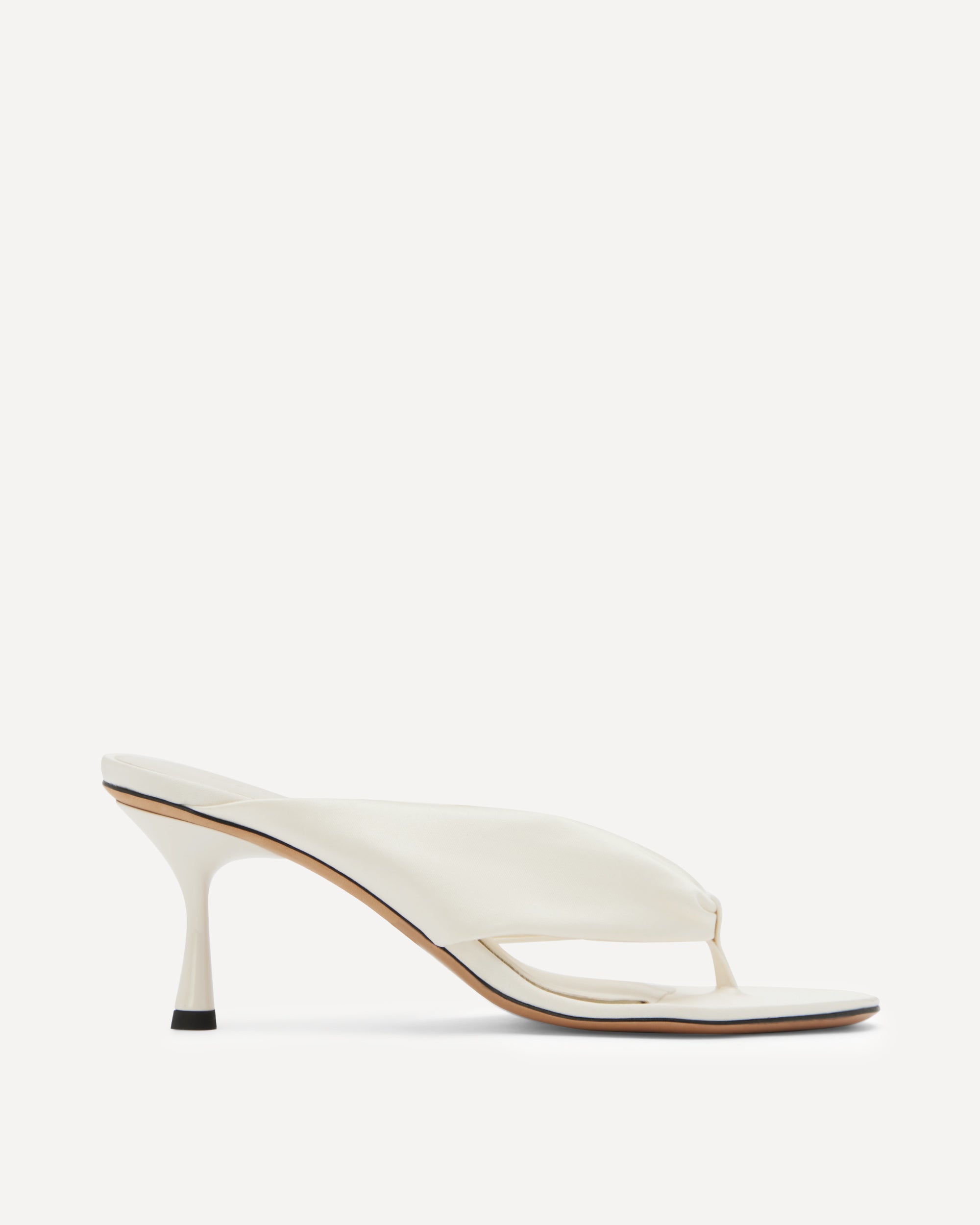 White silk sandal with a thin heel on a white background
