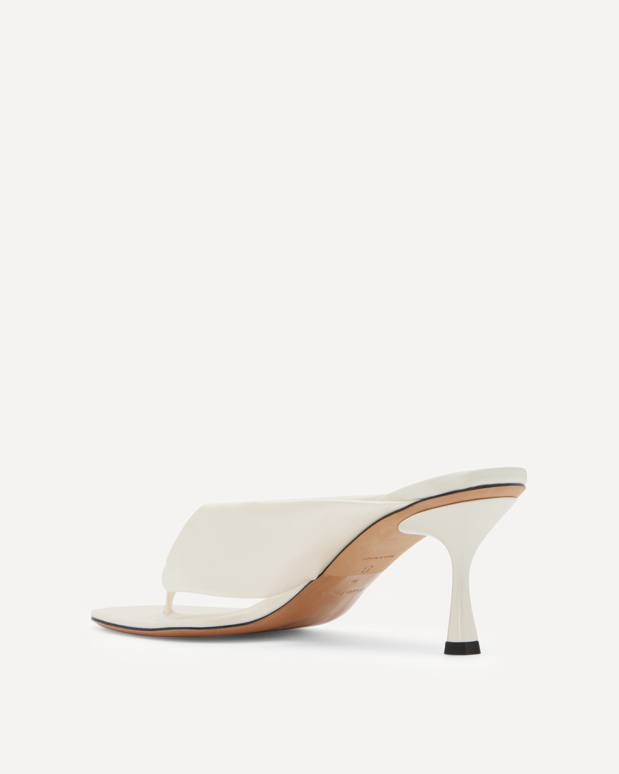 White silk flip flop sandal with a thin heel on a white background