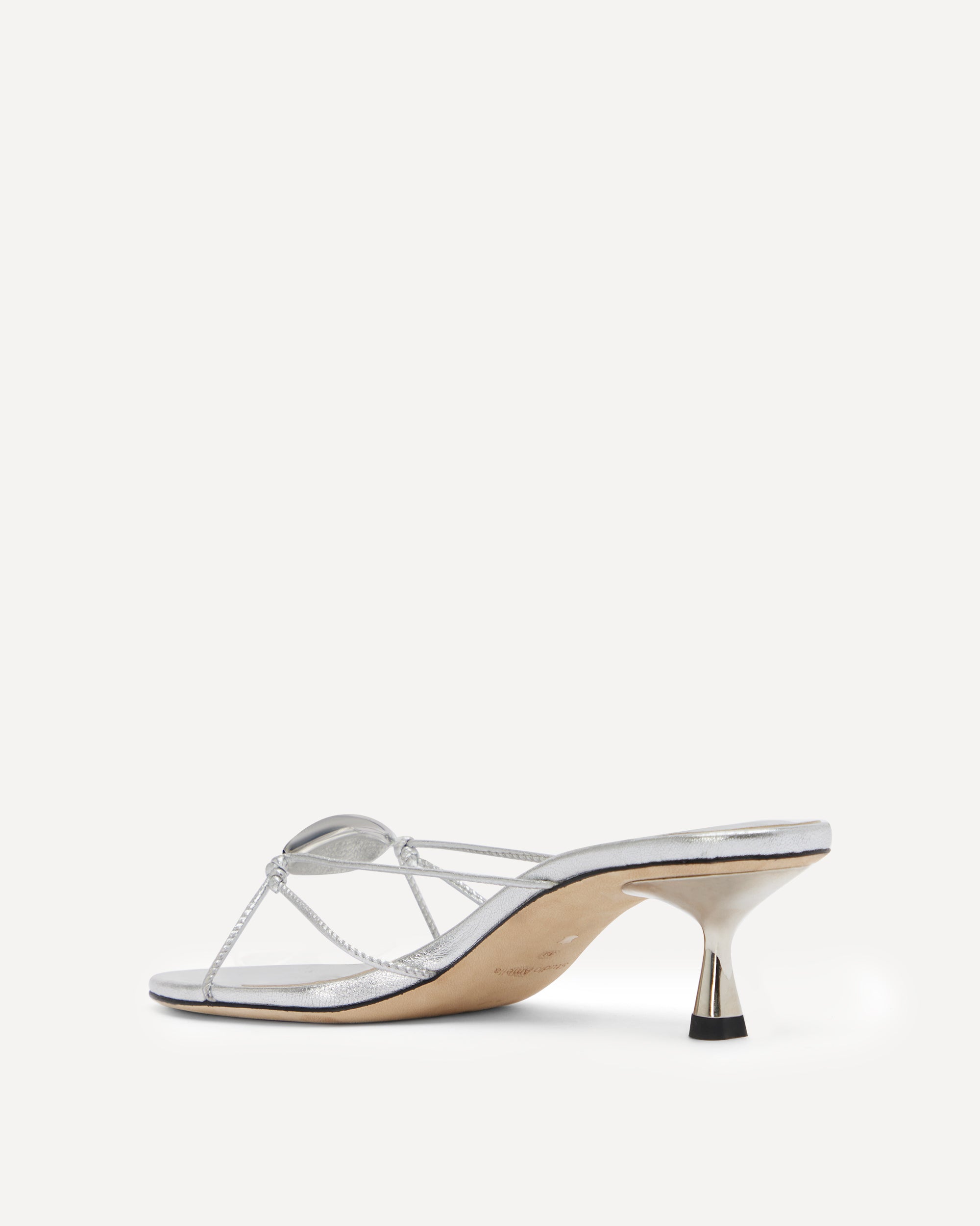 Silver sandal with kitten heel on a white background
