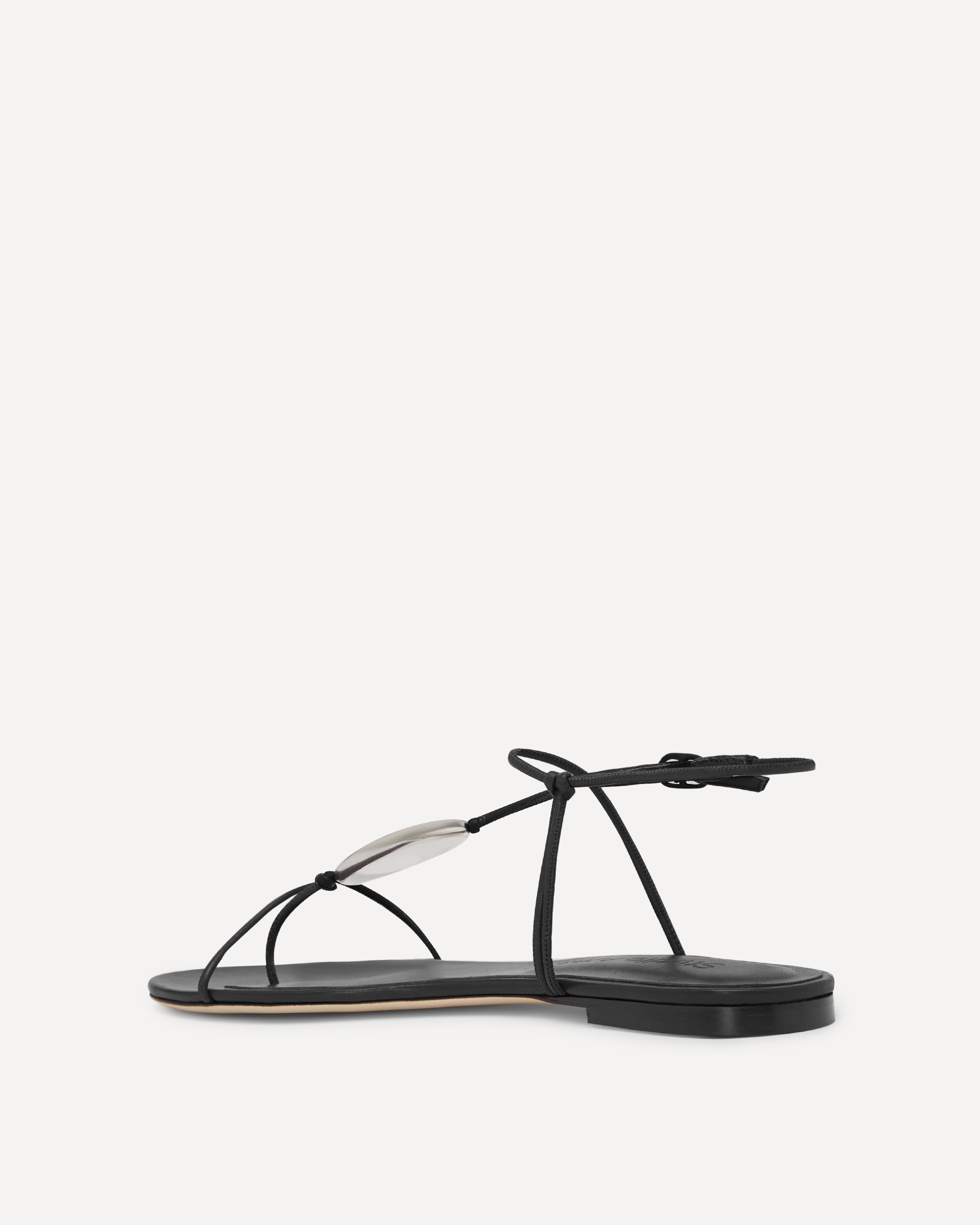 Black strappy flat sandal made of leather