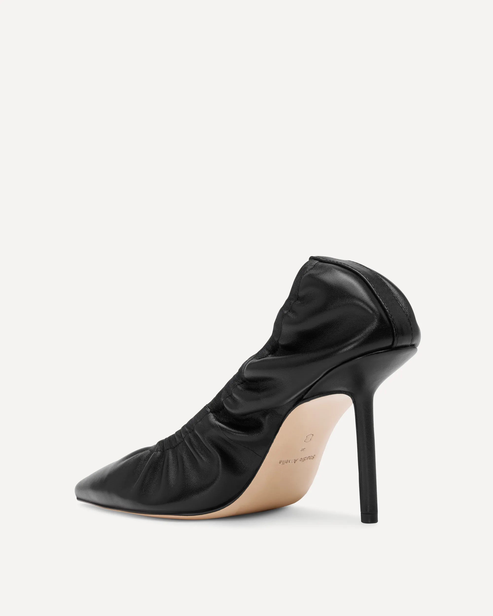 A black leather high heeled pump for women