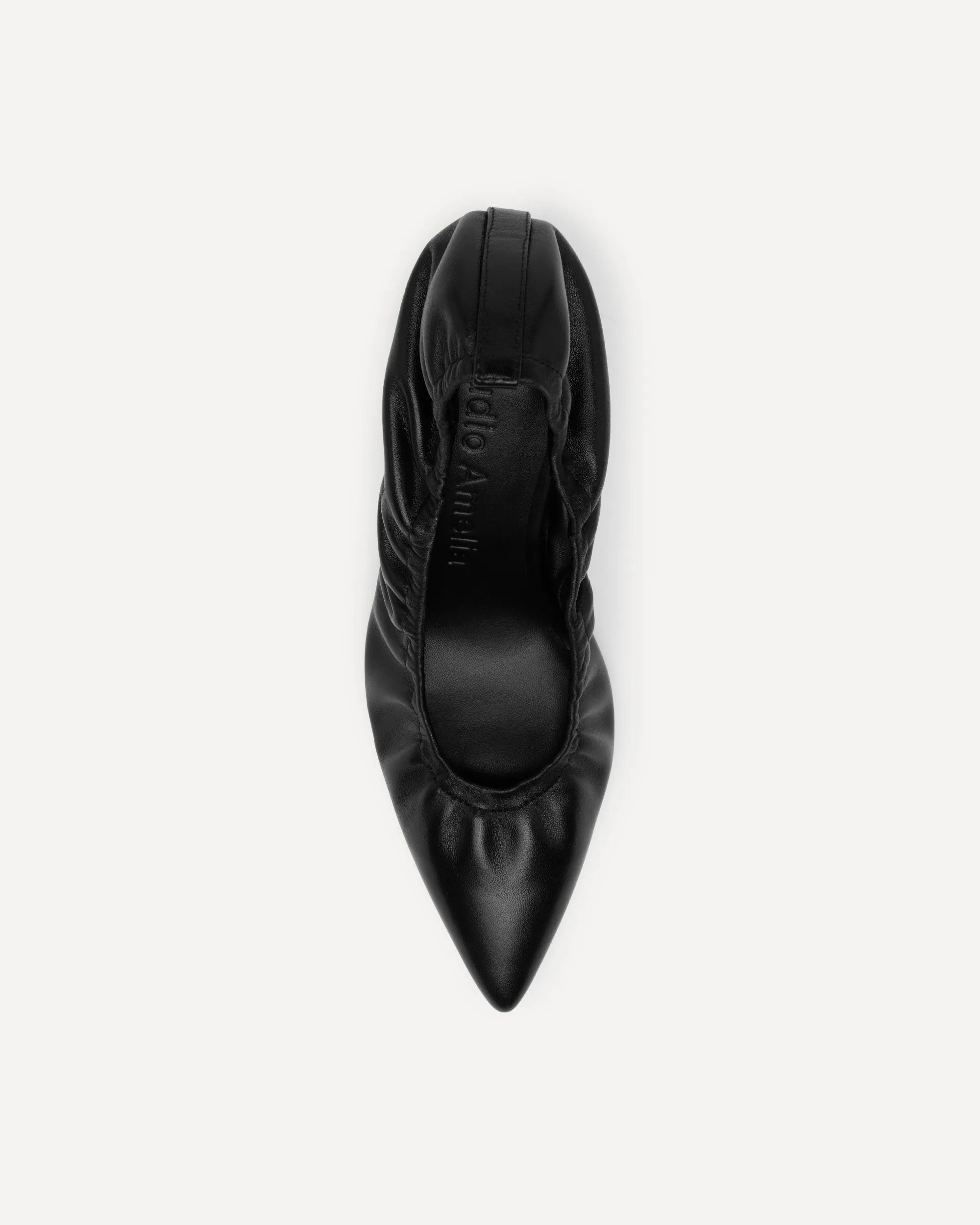 A single black leather pointed-toe pump shoe shown from a top-down view against a light gray background.