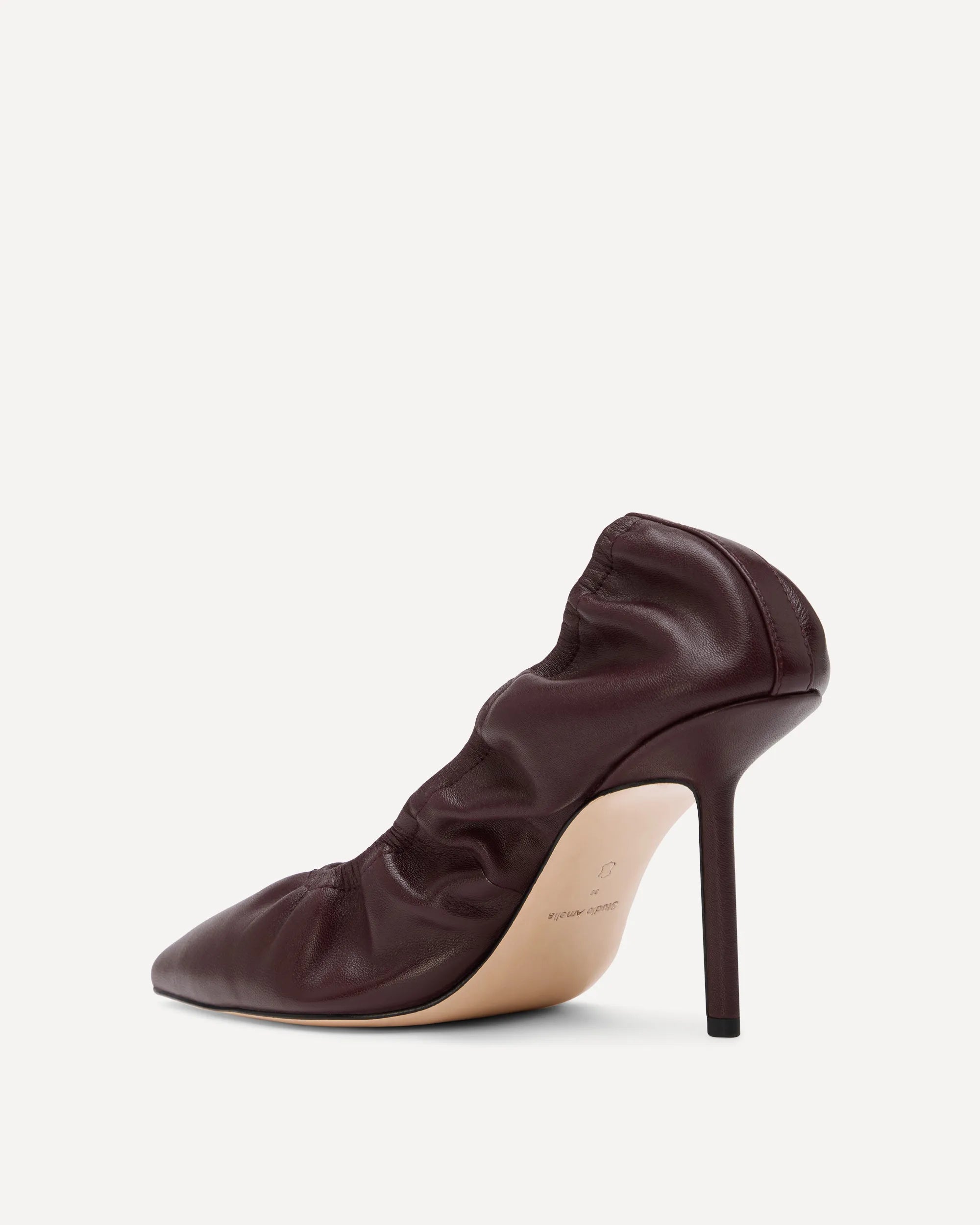 A burgundy leather pump with a high heel